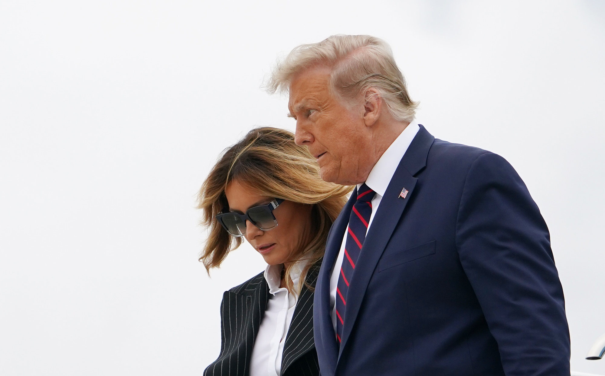 President Donald Trump and First Lady Melania Trump step off Air Force One upon arrival at Cleveland Hopkins International Airport in Cleveland, Ohio on September 29.