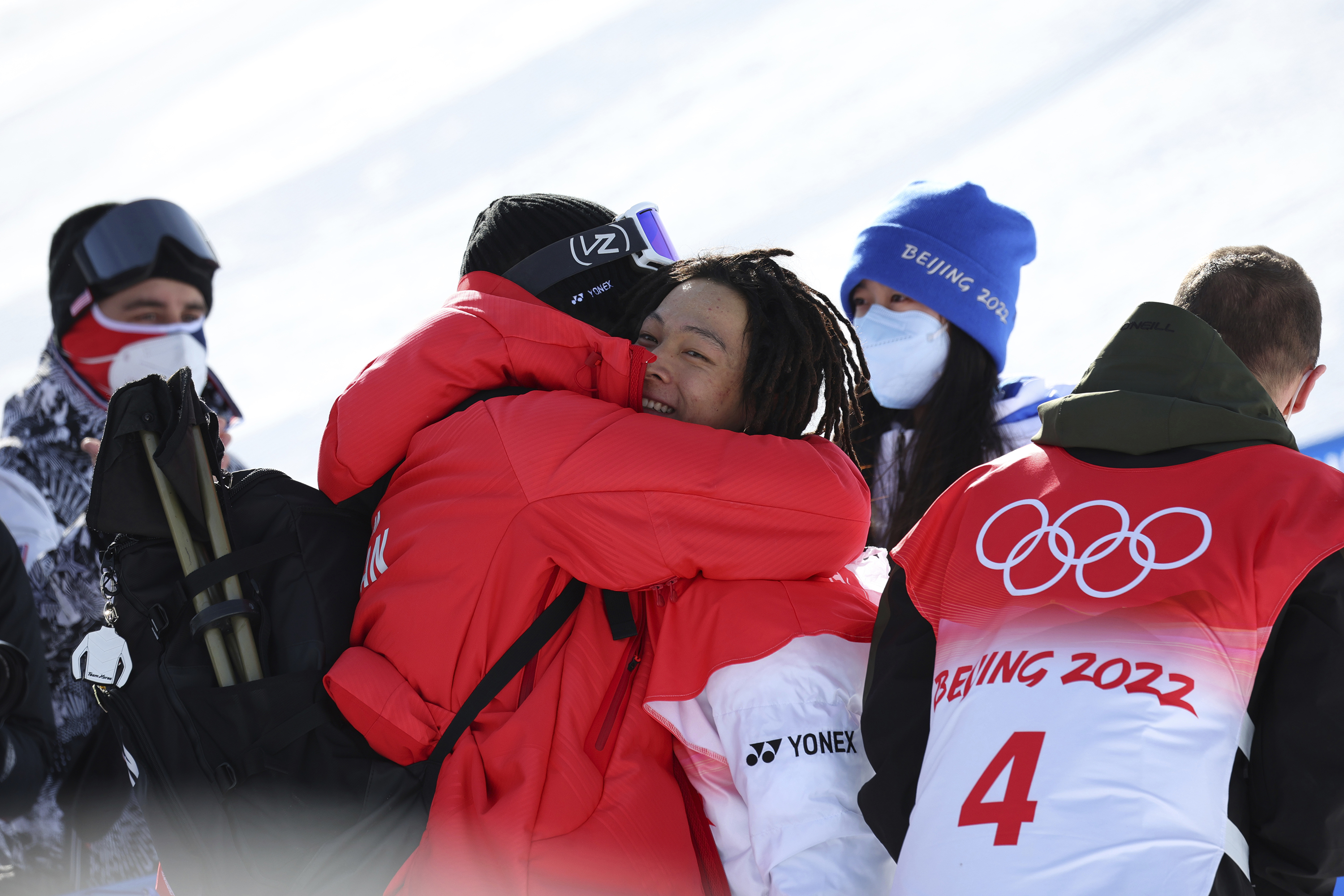 Shaun White and Ayumu Hirano hug each other after the snowboard halfpipe final on Friday.