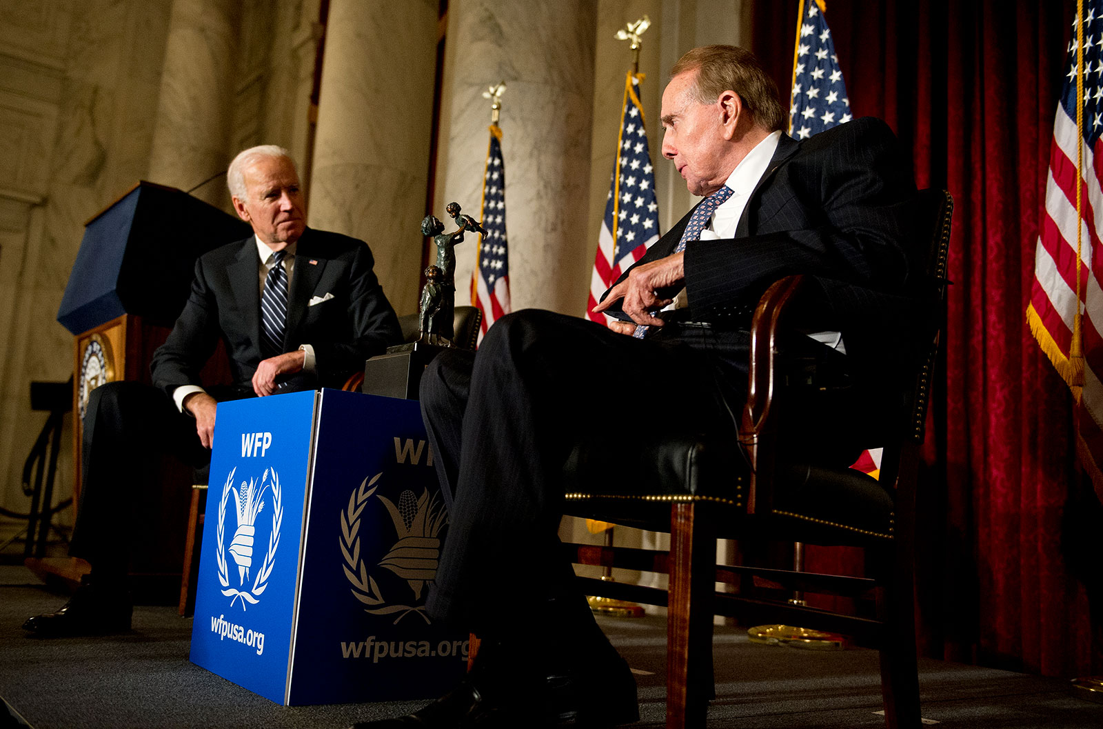 Then-Vice President Joe Biden and Bob Dole talk at an event in Washington, DC, in 2013.