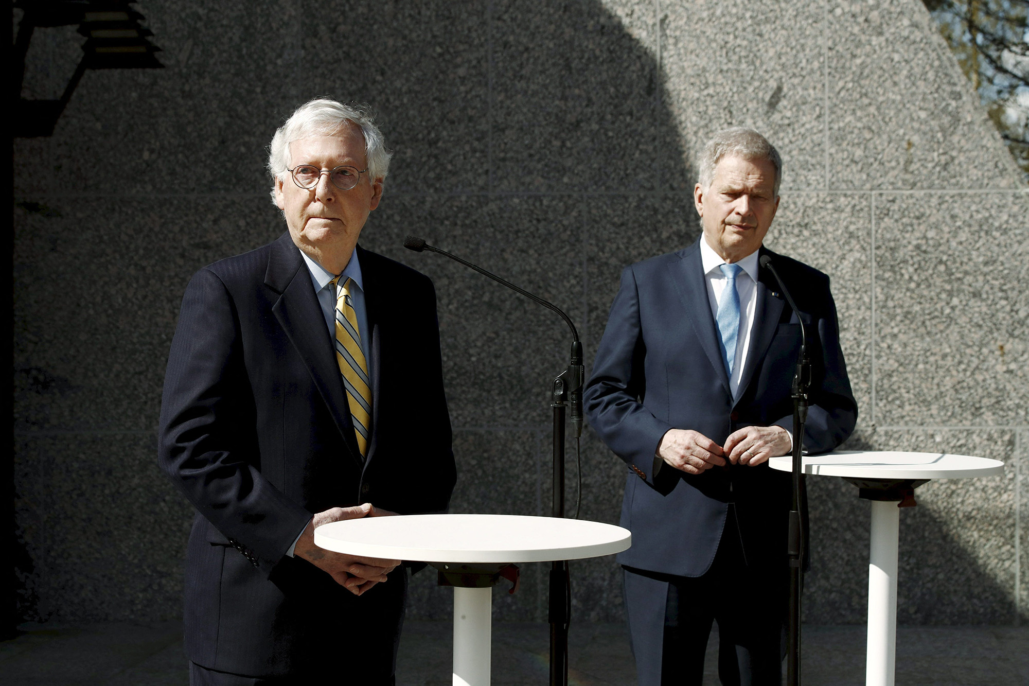 US Senate Minority Leader Mitch McConnell, left, and President of Finland Sauli Niinistö, right, speak to the press after their meeting at the President's official residence Mantyniemi in Helsinki, Finland, on May 16, 