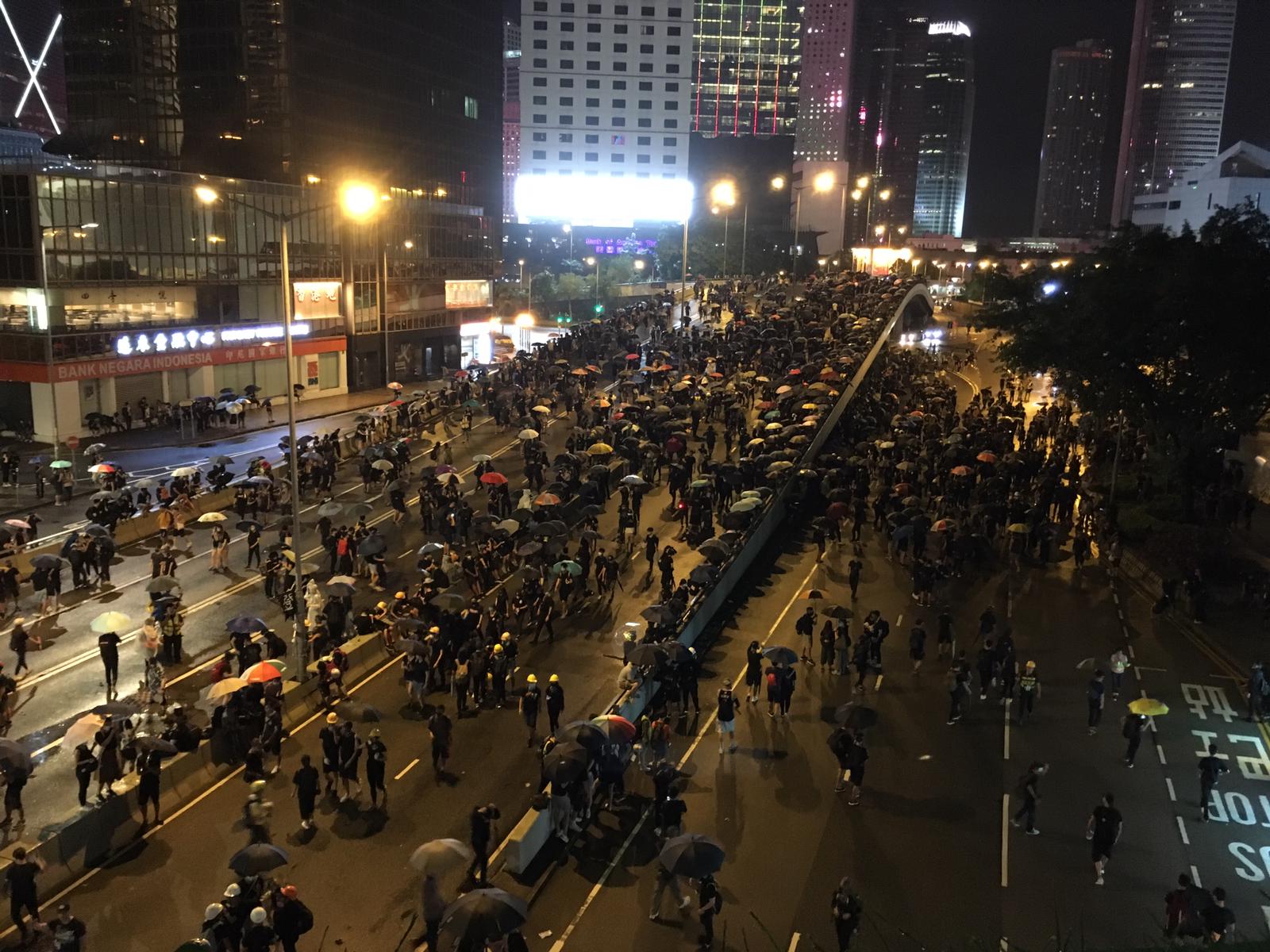 Protesters gather on Harcourt Road by the Legislative Council offices. 