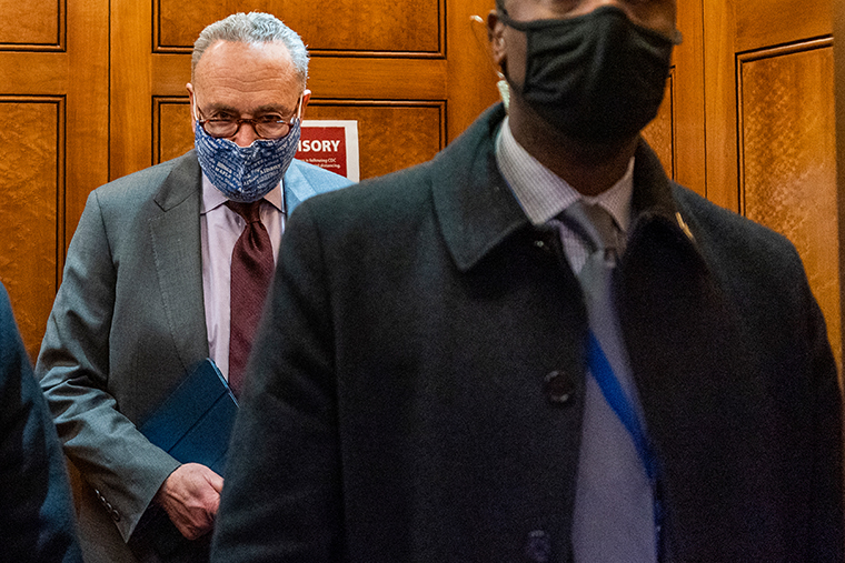 Senate Majority Leader Chuck Schumer of N.Y, takes the elevator in the U.S. Capitol, Friday, Jan. 22, 2021, in Washington. 