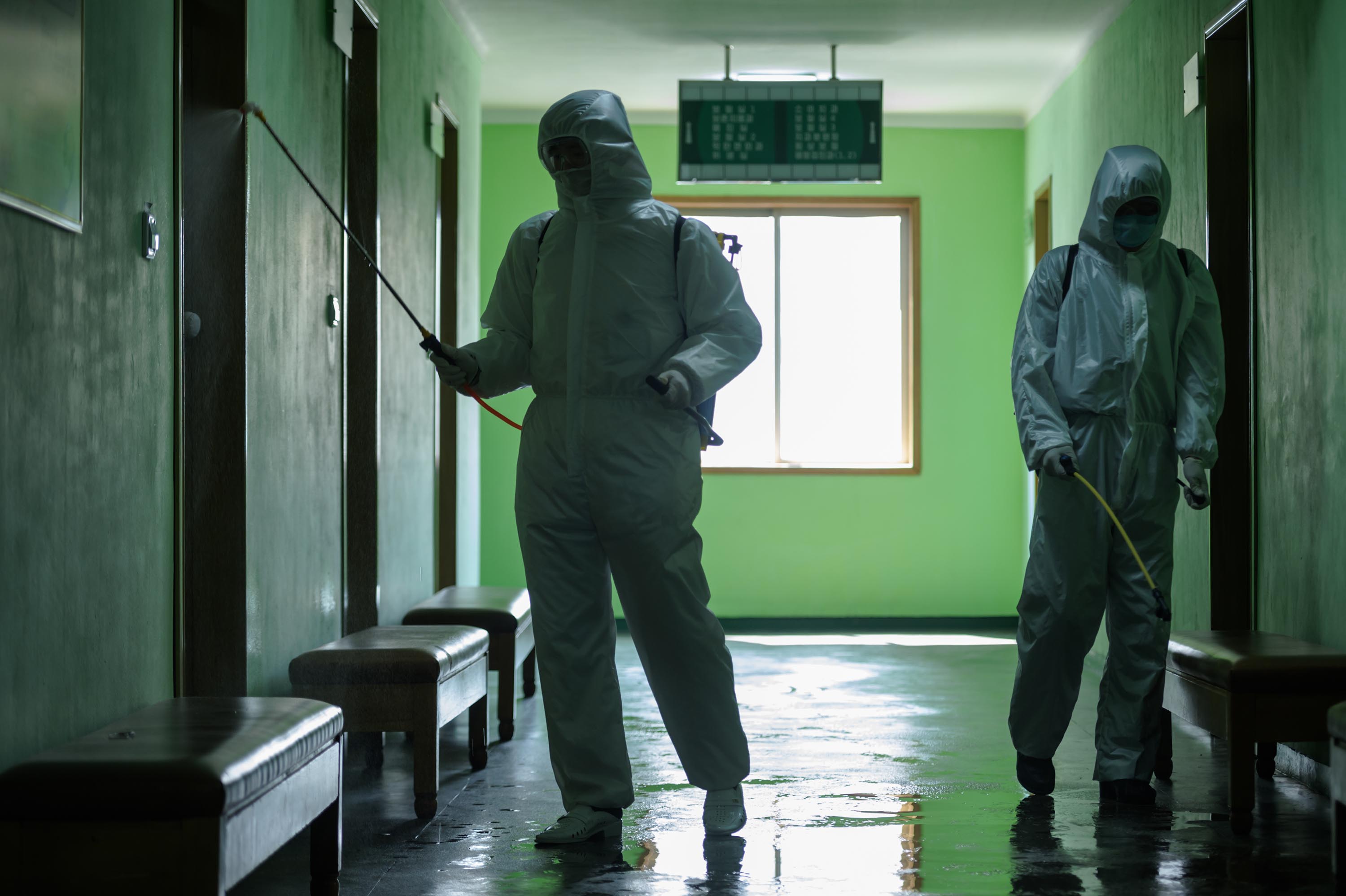 Health officials disinfect a corridor at the Pyongchon District People's Hospital in Pyongyang, North Korea, in April.