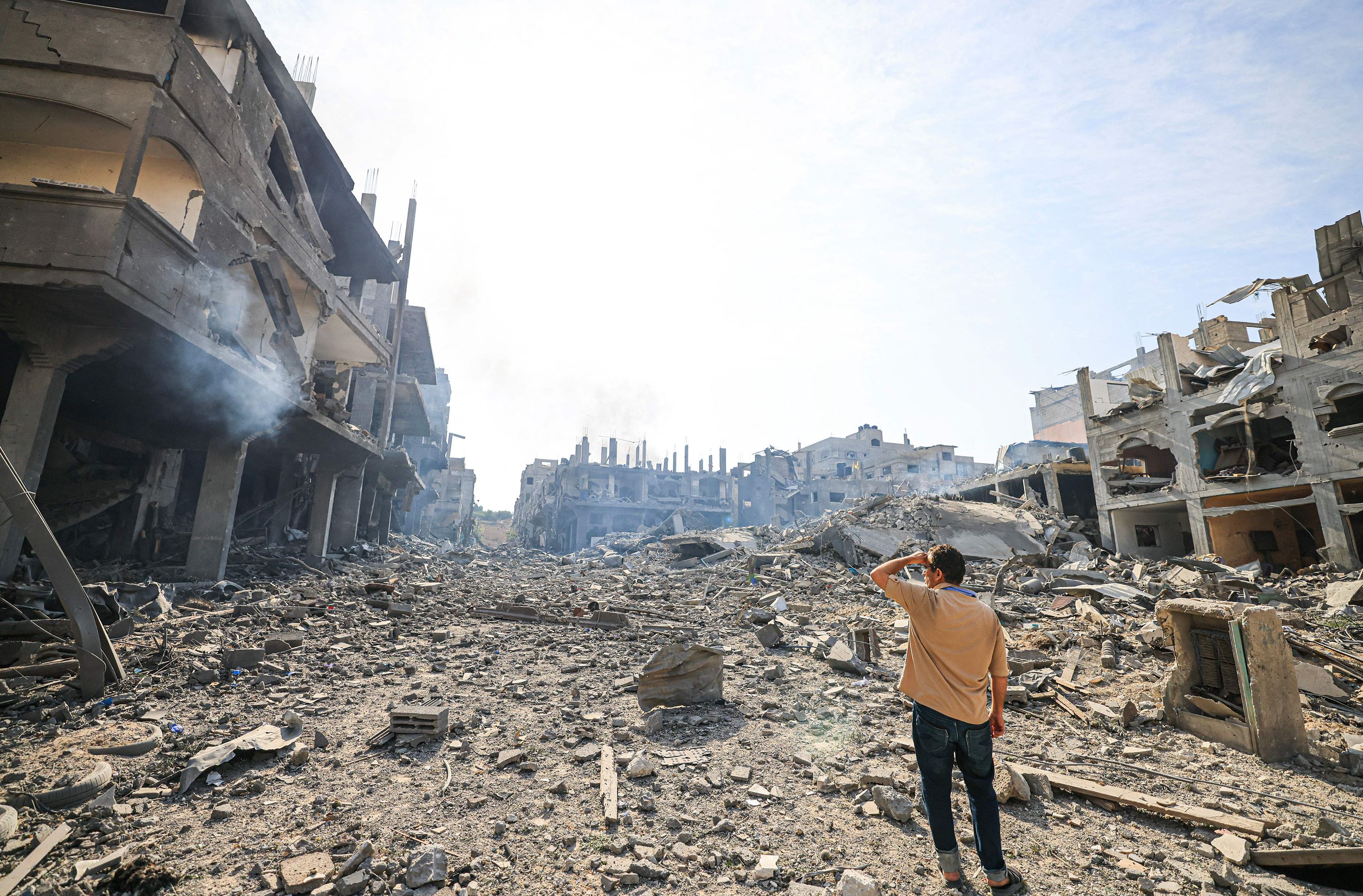 A man looks at destruction from Israeli airstrikes in Gaza, on October 11, 2023. 