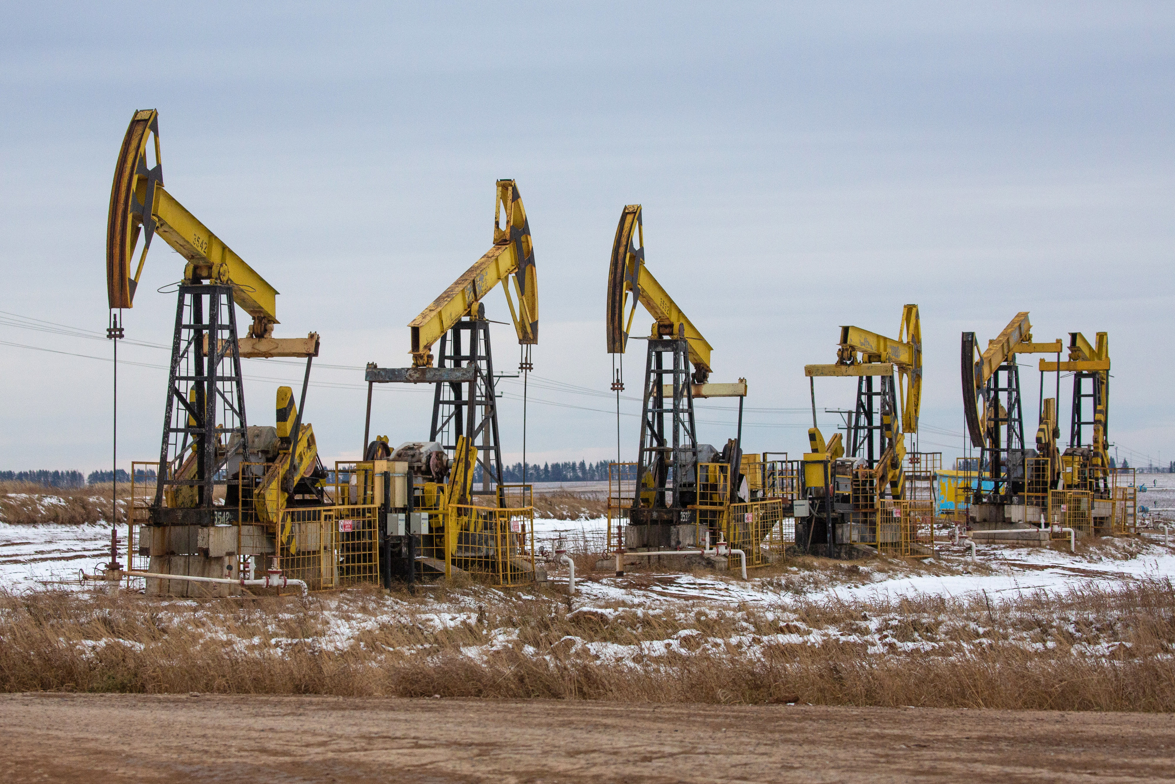 Oil pumping jacks in a Rosneft Oil Co. oilfield in the Udmurt Republic in Russia, on November 20, 2020.