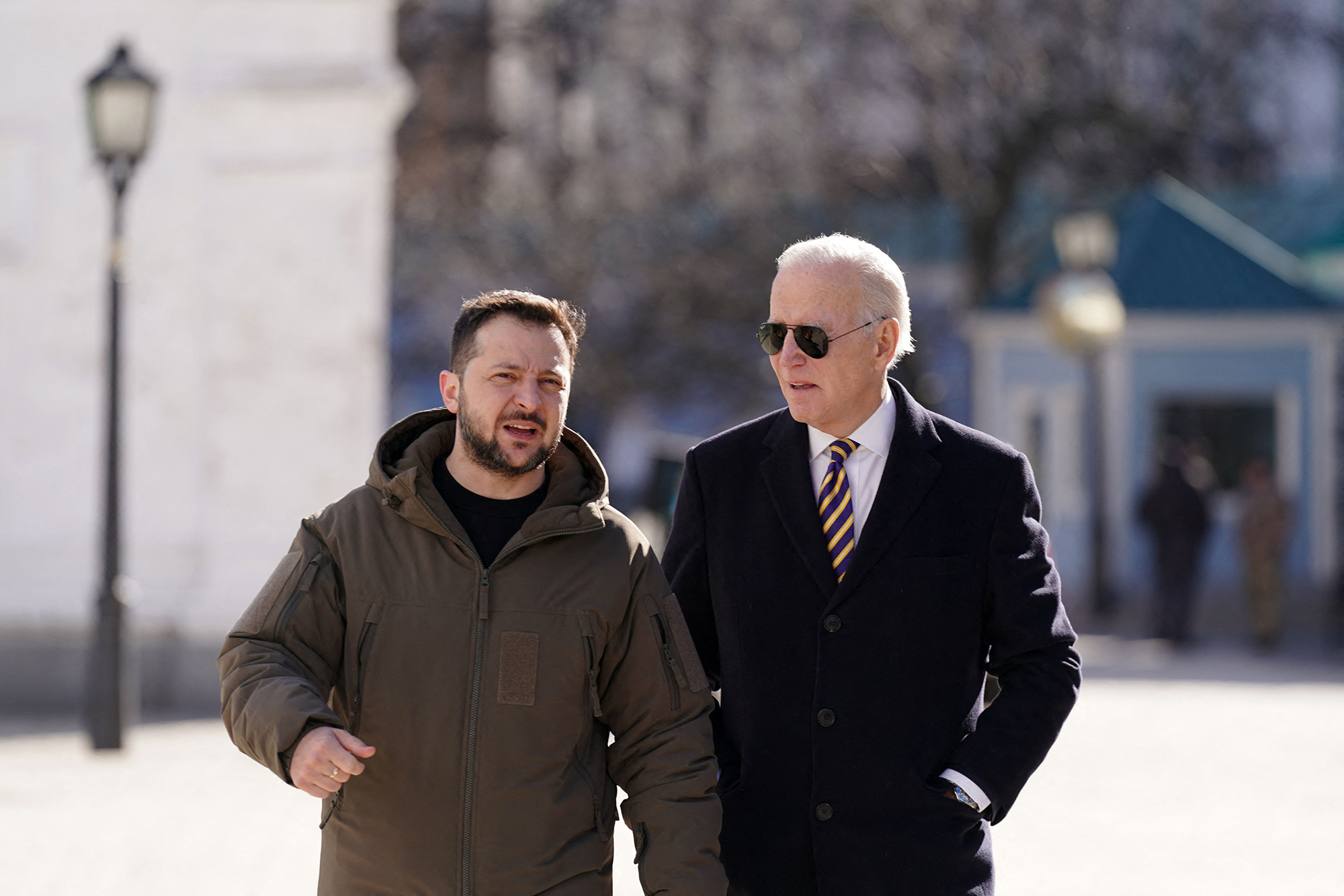 President Joe Biden walks next to Ukrainian President Volodymyr Zelensky as he arrives for a visit in Kyiv on February 20.