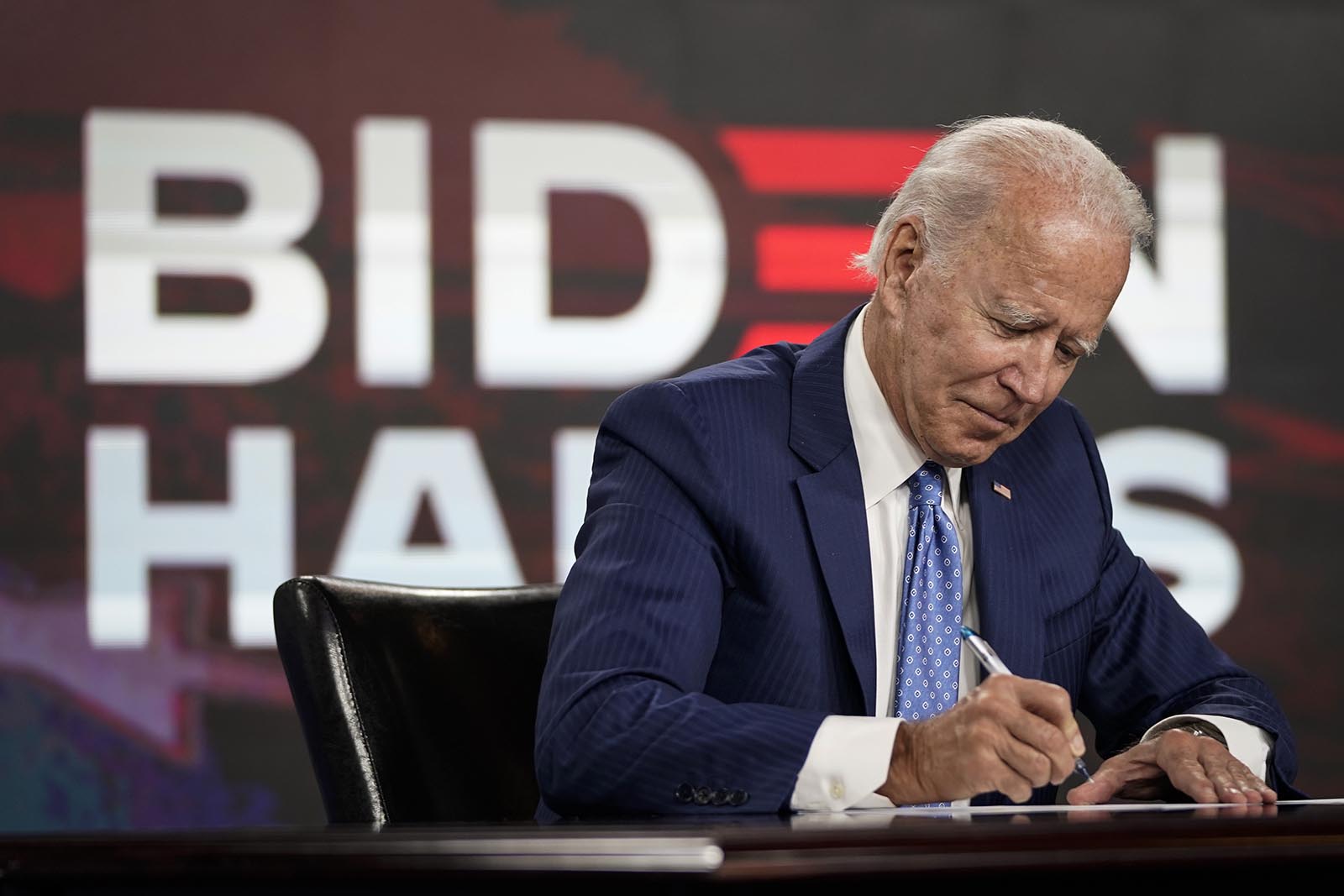 Presumptive Democratic presidential nominee former Vice President Joe Biden signs required documents for receiving the Democratic nomination for President at the Hotel DuPont on August 14, in Wilmington, Delaware.