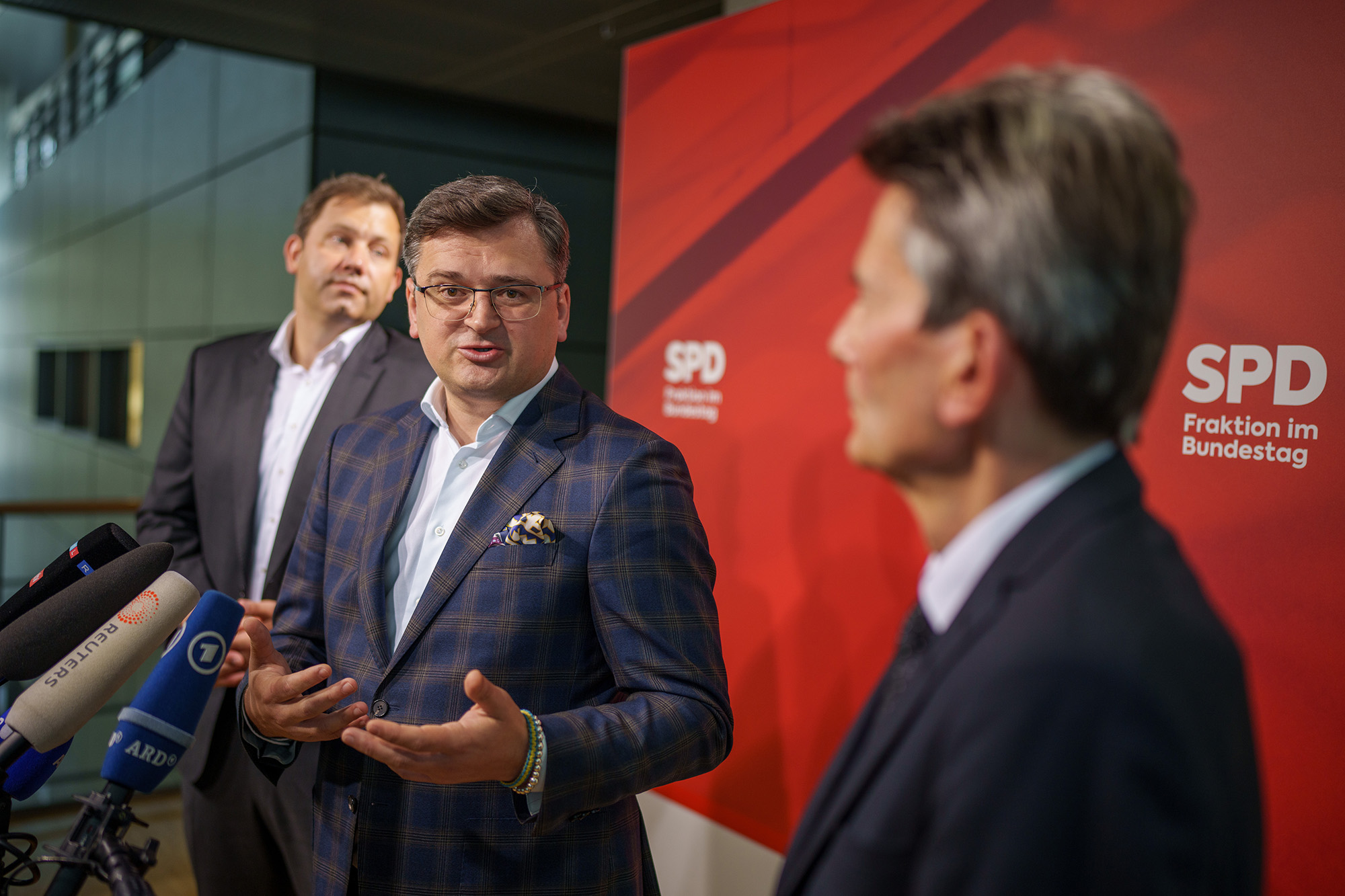 Ukrainian Foreign Minister Dmytro Kuleba, center, speaks between Lars Klingbeil, left, SPD federal chairman, and Rolf Mützenich, right, chairman of the SPD parliamentary group, after talks in the Bundestag, Berlin, Germany on May 12.