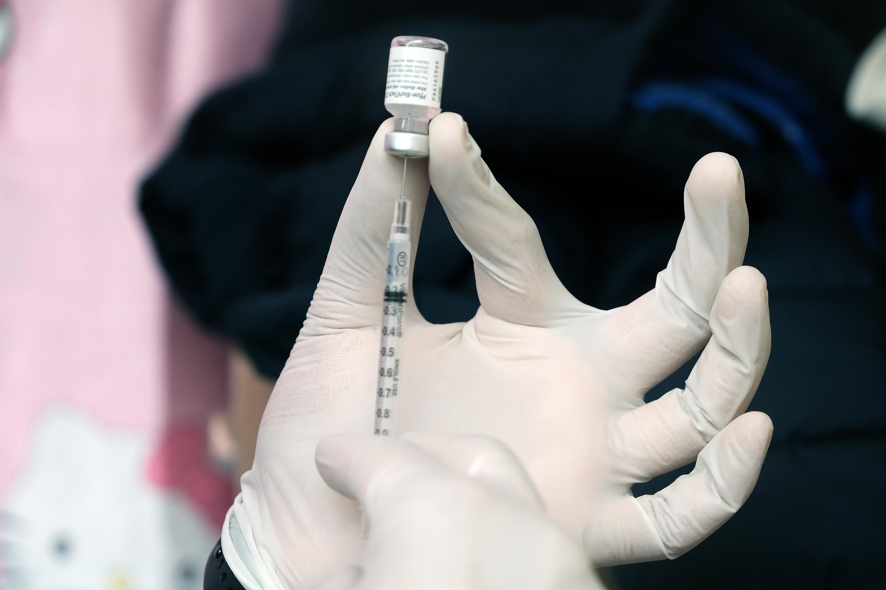 A pharmacist prepares the Pfizer vaccine at a pop-up vaccination clinic in New York on March 26.