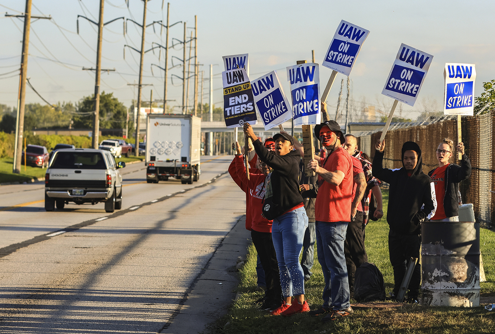 United Auto Workers hold signs while on strike at the Stellantis Toledo Assembly Complex in Toledo, Ohio.