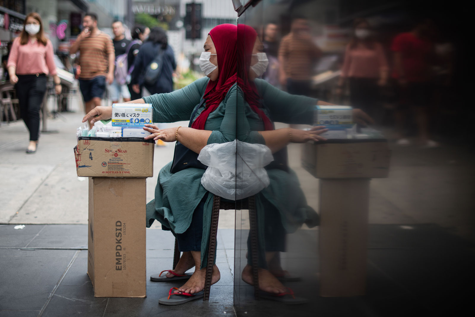 A woman sells protective facemasks amid fears over the spread of the novel coronavirus in Kuala Lumpur on February 13.