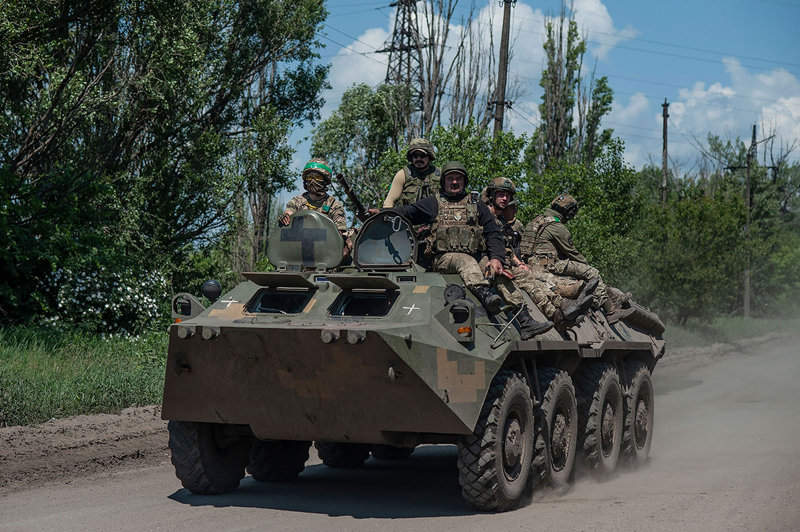 Ukrainian soldiers ride an APC on the frontline near Bakhmut, Ukraine, on Monday, June 5