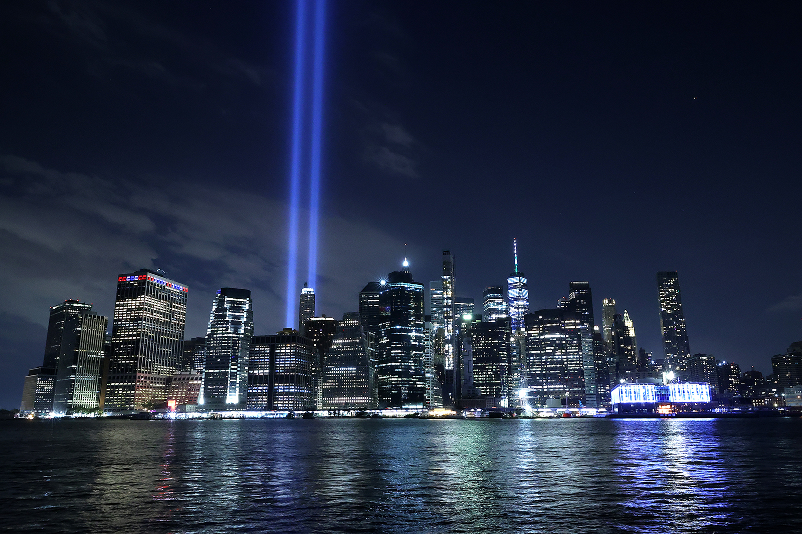 The Tribute In Light shines into the sky from Lower Manhattan during a test on September 07, 2021 as seen from the Brooklyn borough of New York City. 