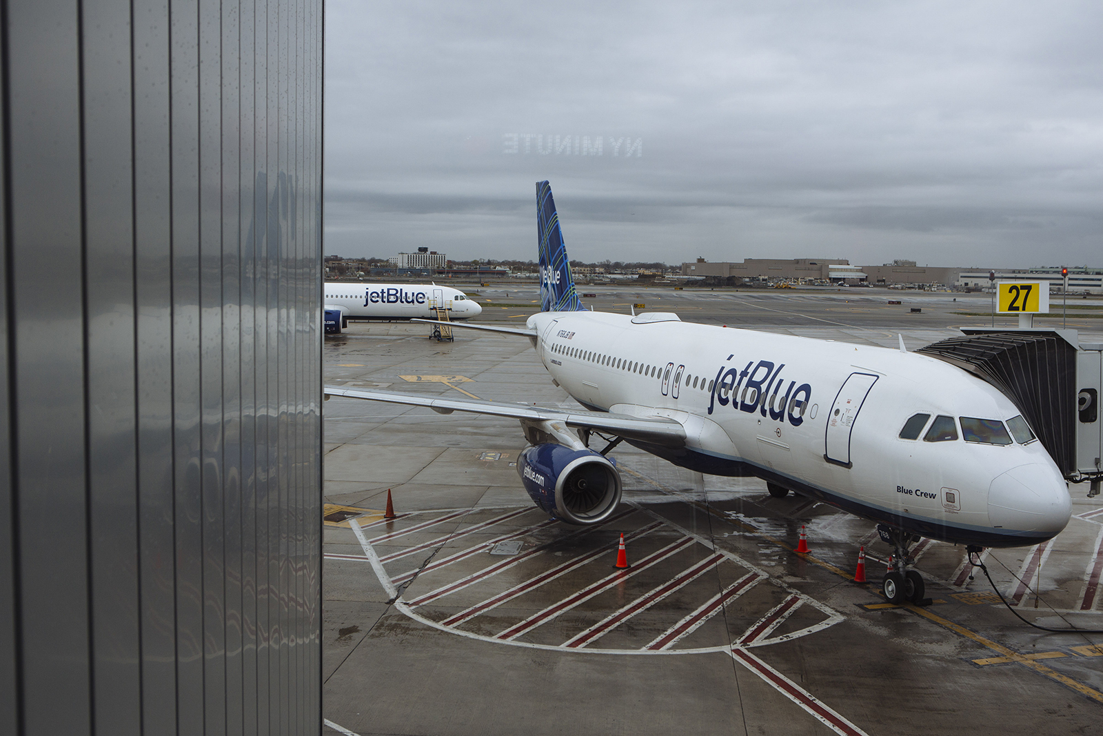 A JetBlue Airways Corp. aircraft sits at a gate in Terminal 5 at John F. Kennedy International Airport (JFK) in New York on April 9.