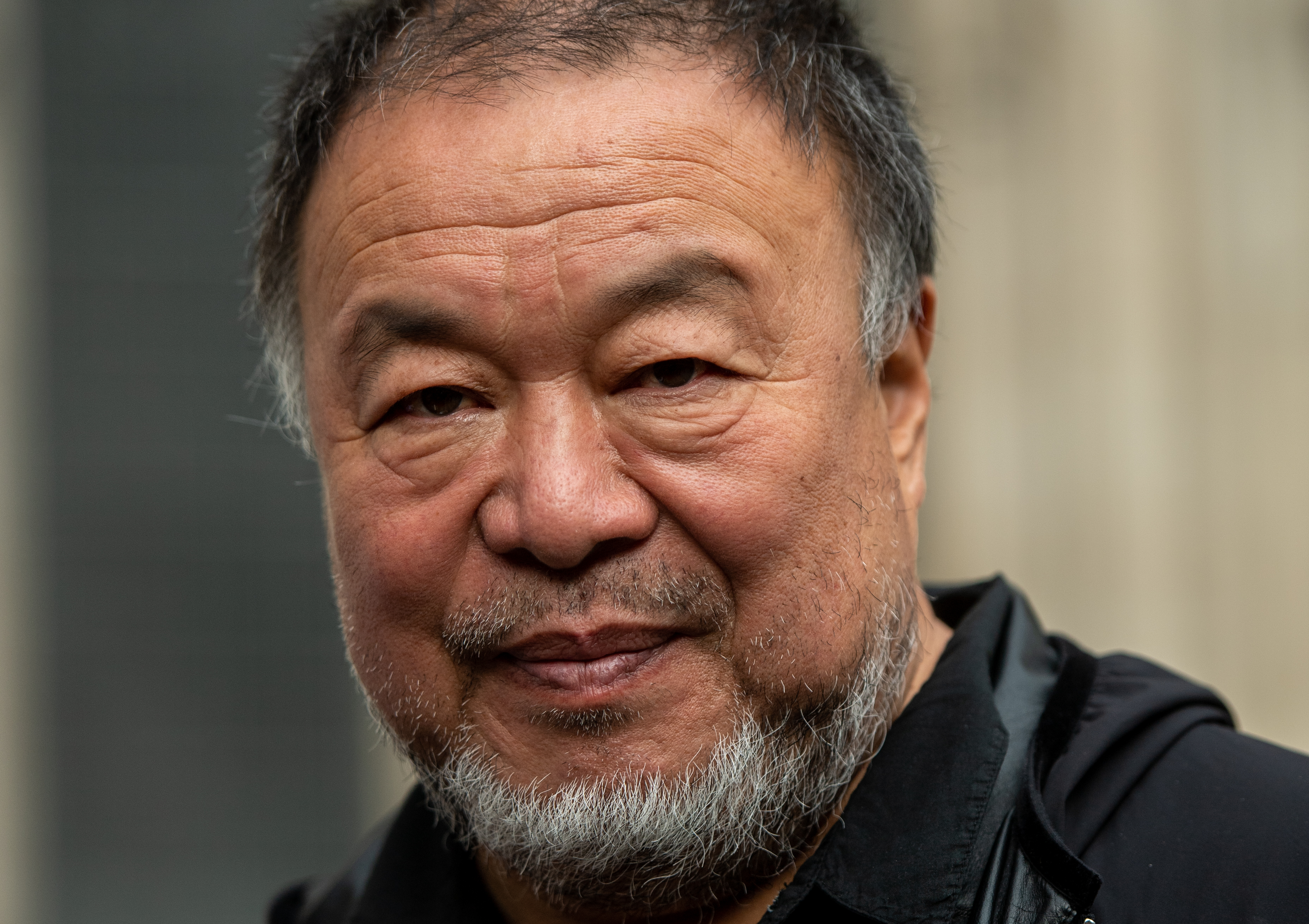 Chinese dissident artist and activist Ai Weiwei is seen outside the Royal Courts of Justice on October 27 in London, England.