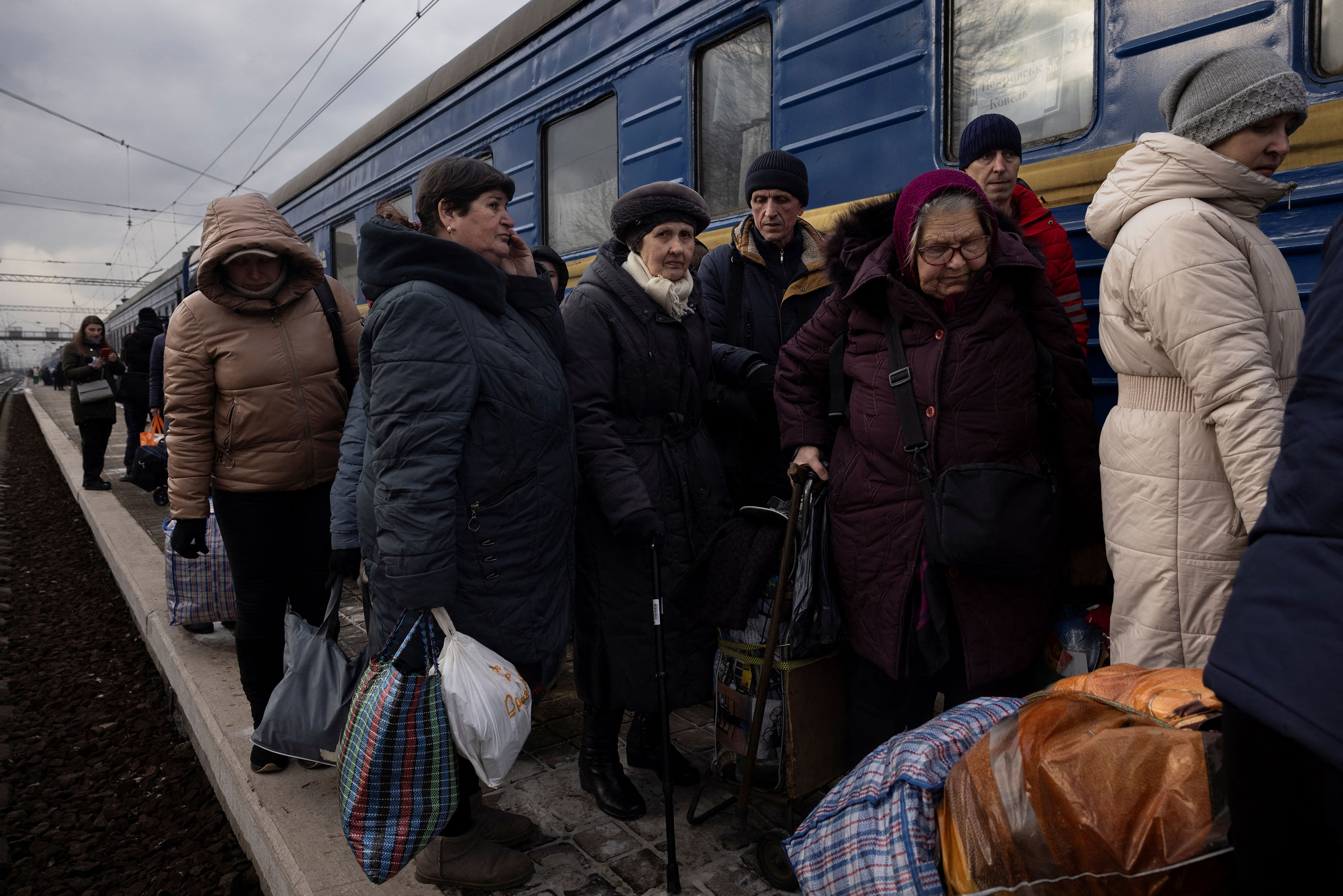People wait to board an evacuation train in Pokrovsk after an increase of Russian missile strikes in the area around Avdiivka, Ukraine, on Tuesday. 