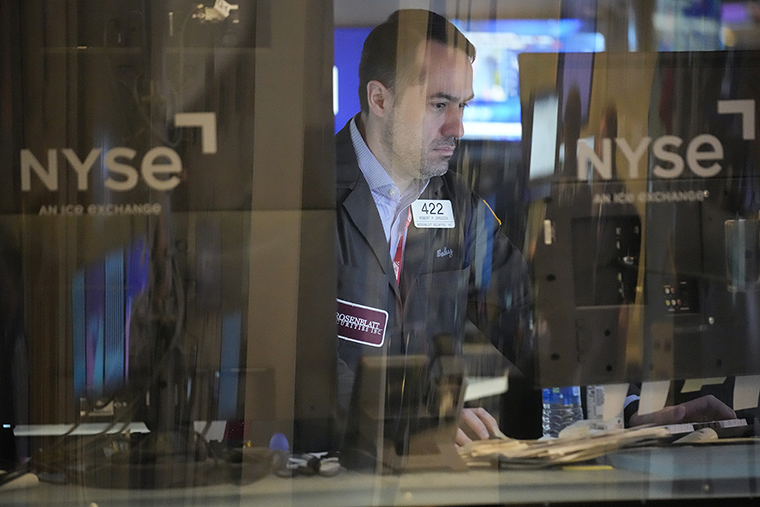 Traders work on the floor at the New York Stock Exchange on Feb. 1.