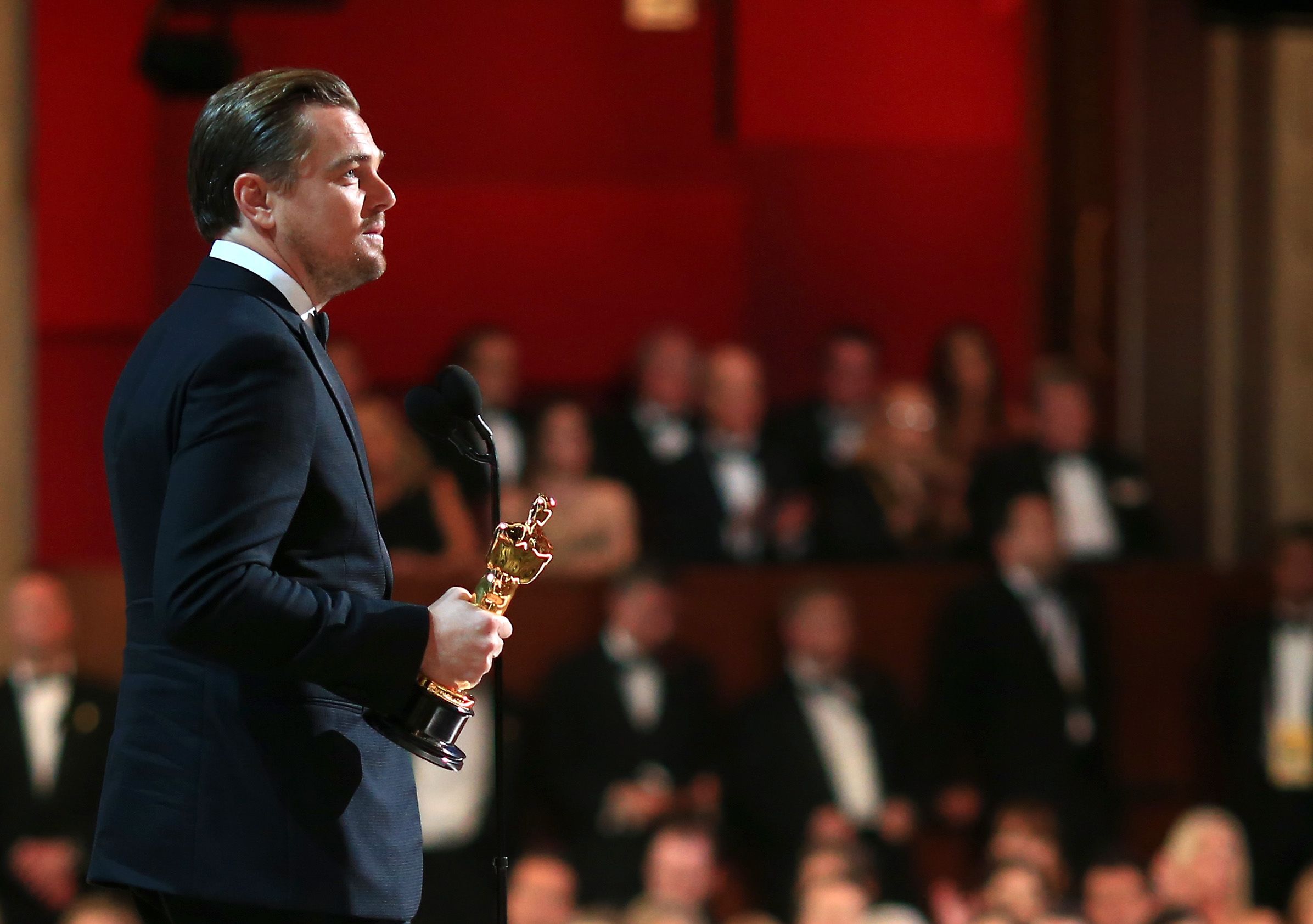 Leonardo DiCaprio accepts the Oscar for best lead actor in 2016.