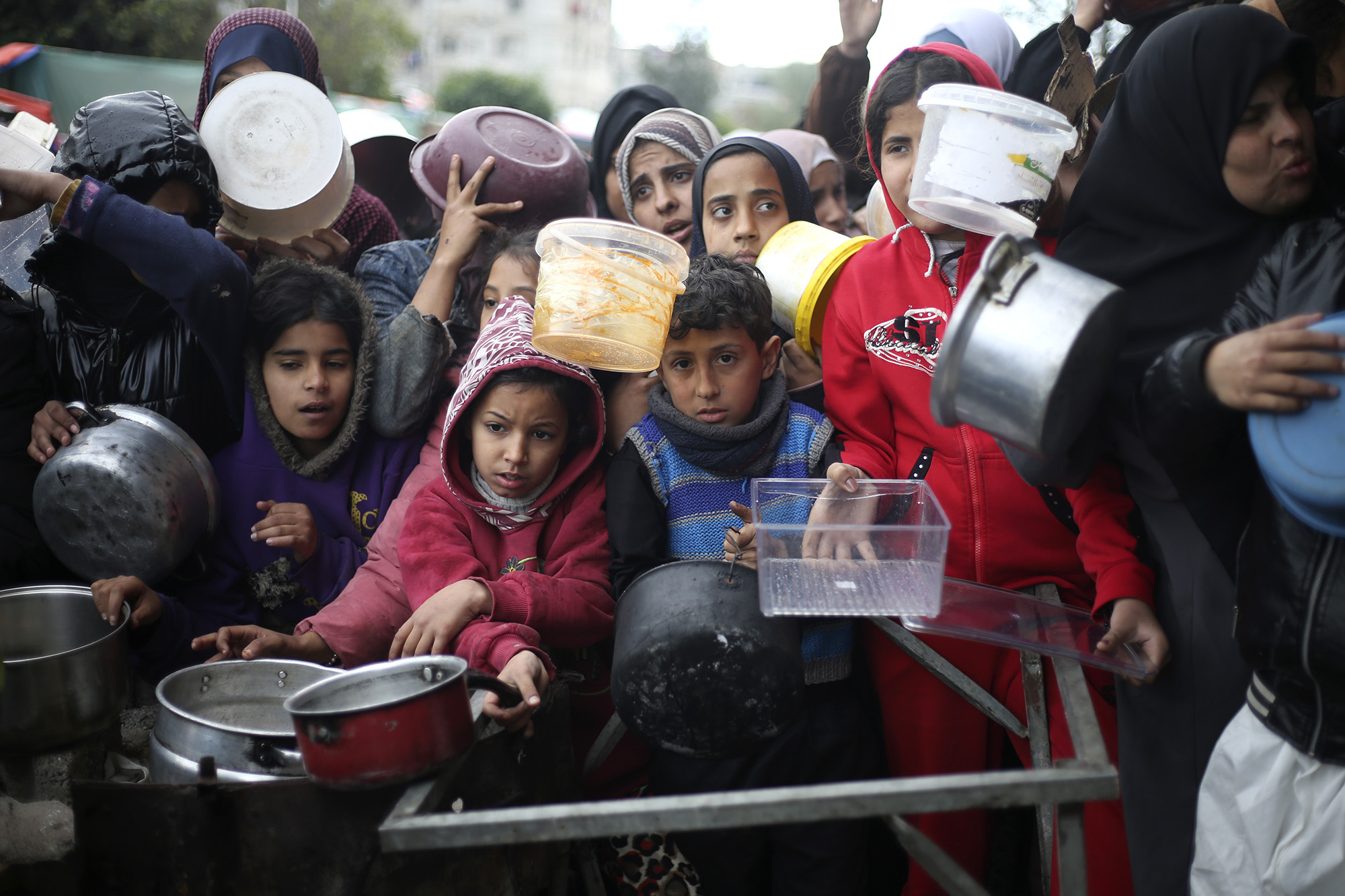 Palestinians line up for food aid in Khan Younis, Gaza, on February 2.