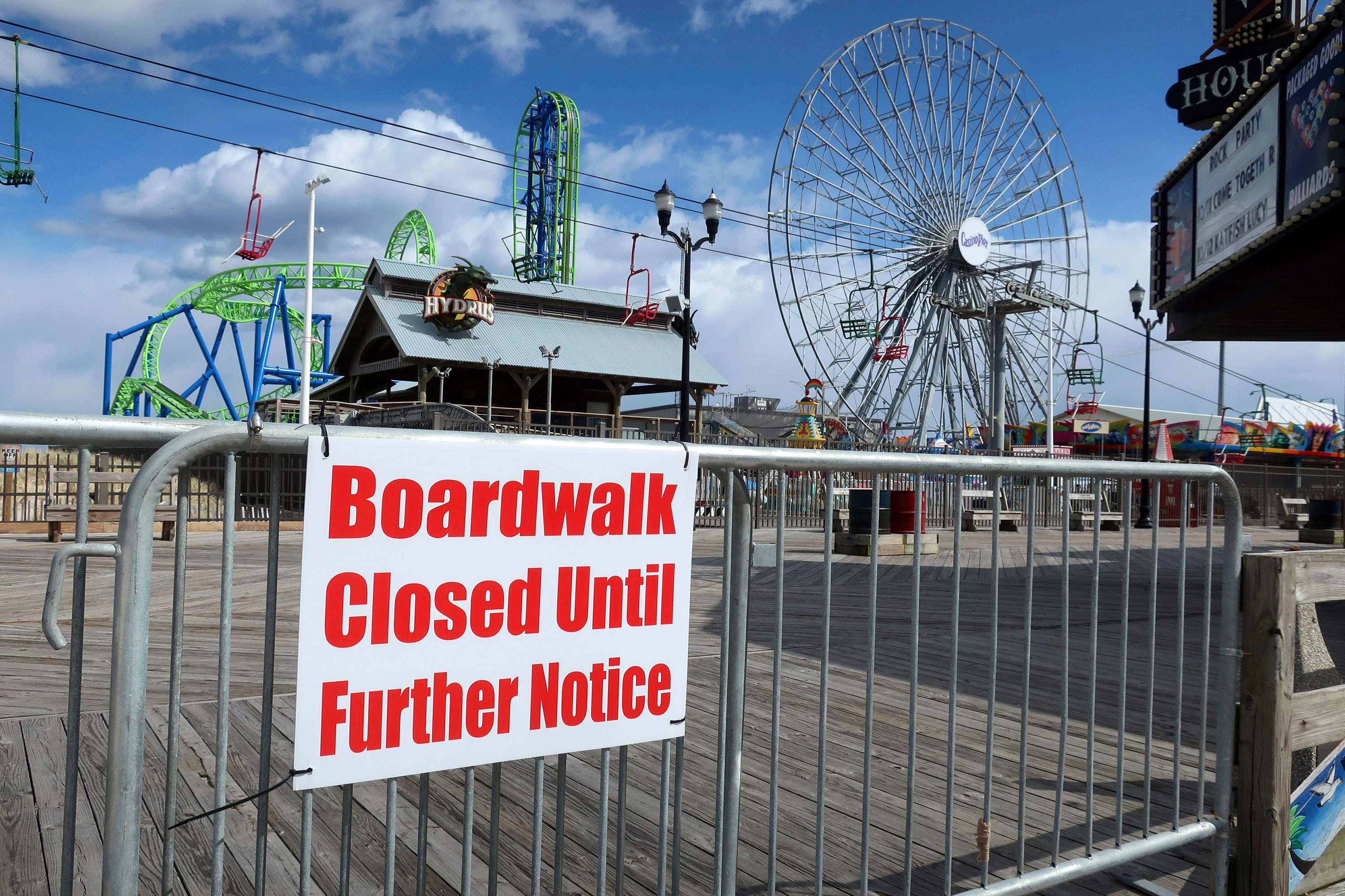 A sign informs visitors that the boardwalk at Seaside Heights in New Jersey is closed on April 10.