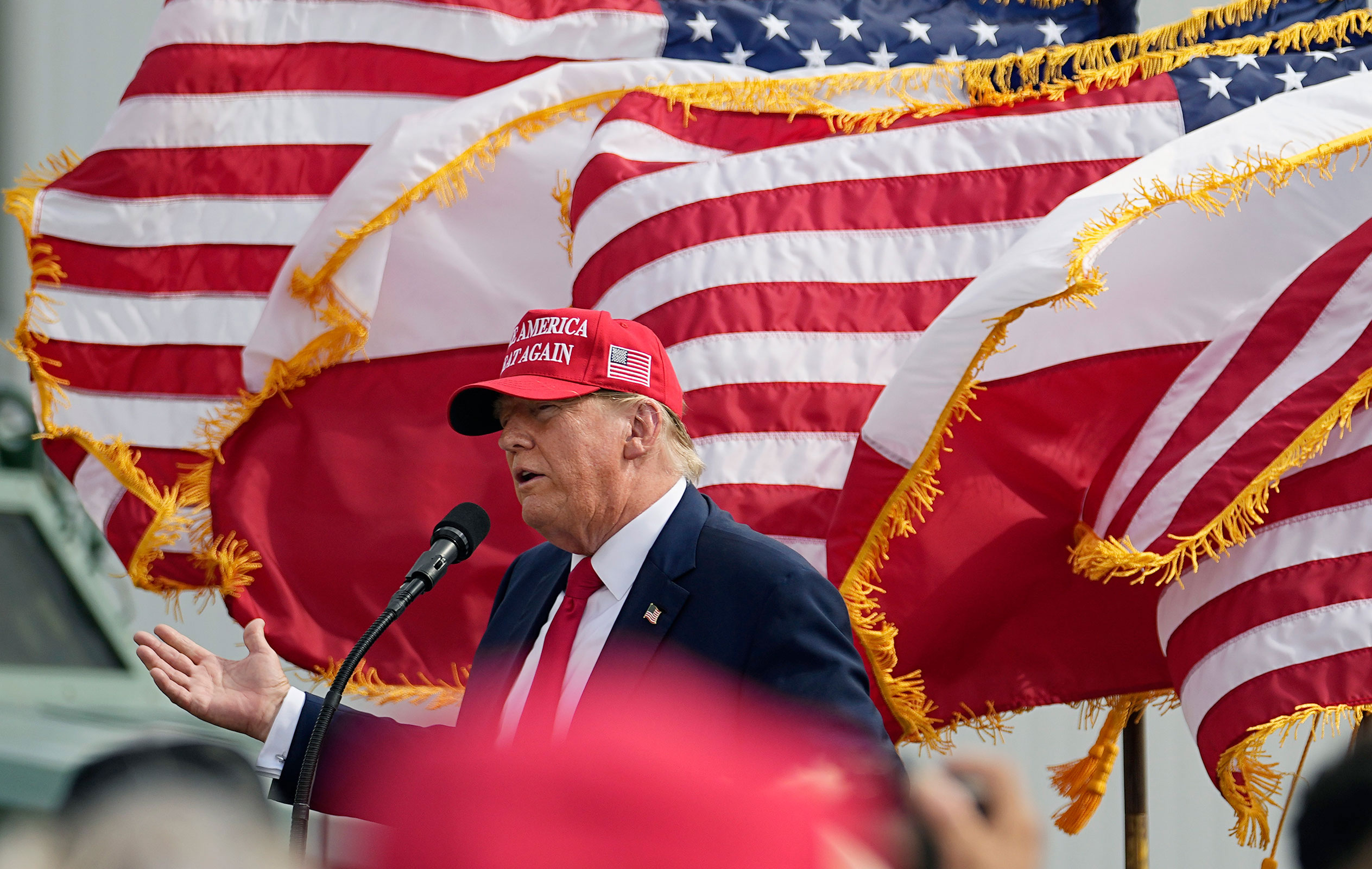 Former President Donald Trump speaks to supporters after he was endorsed by Texas Gov. Greg Abbott at the South Texas International Airport on Sunday, Nov. 19 in Edinburg, Texas.