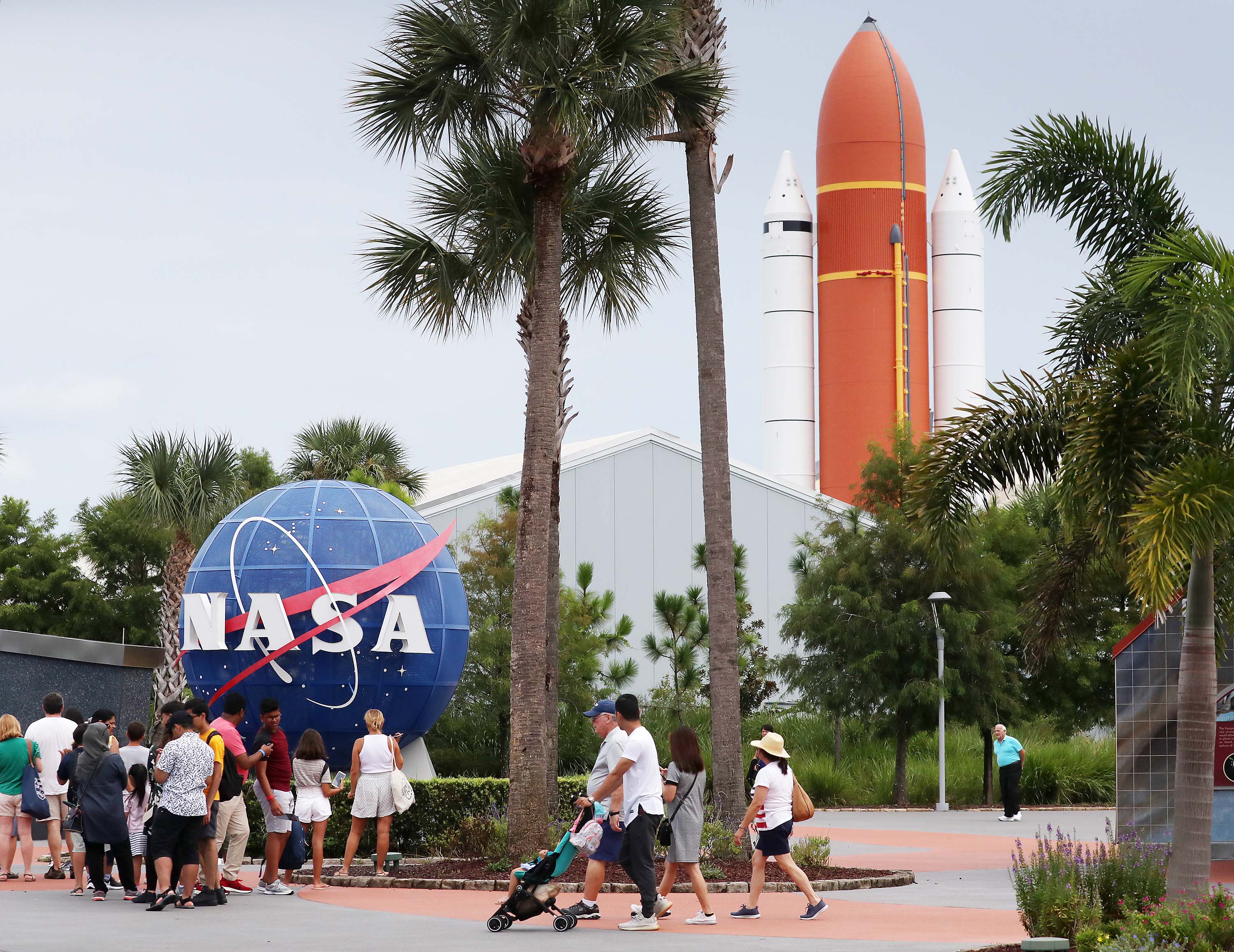 People visit the Kennedy Space Center Visitor Complex in Cape Canaveral, Florida in August 2019.