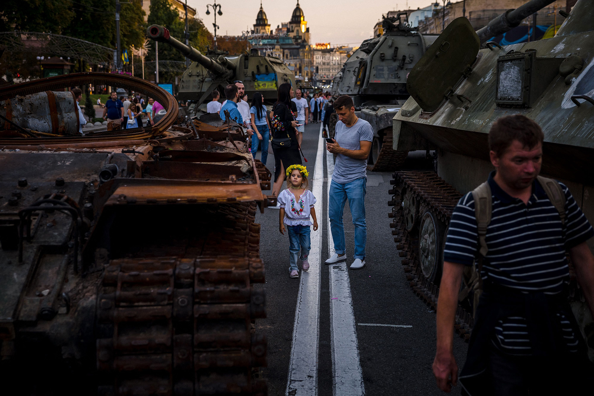 People look at destroyed Russian military equipments in Kyiv on August 23, during an open-air military museum ahead of Ukraine's Independence Day.