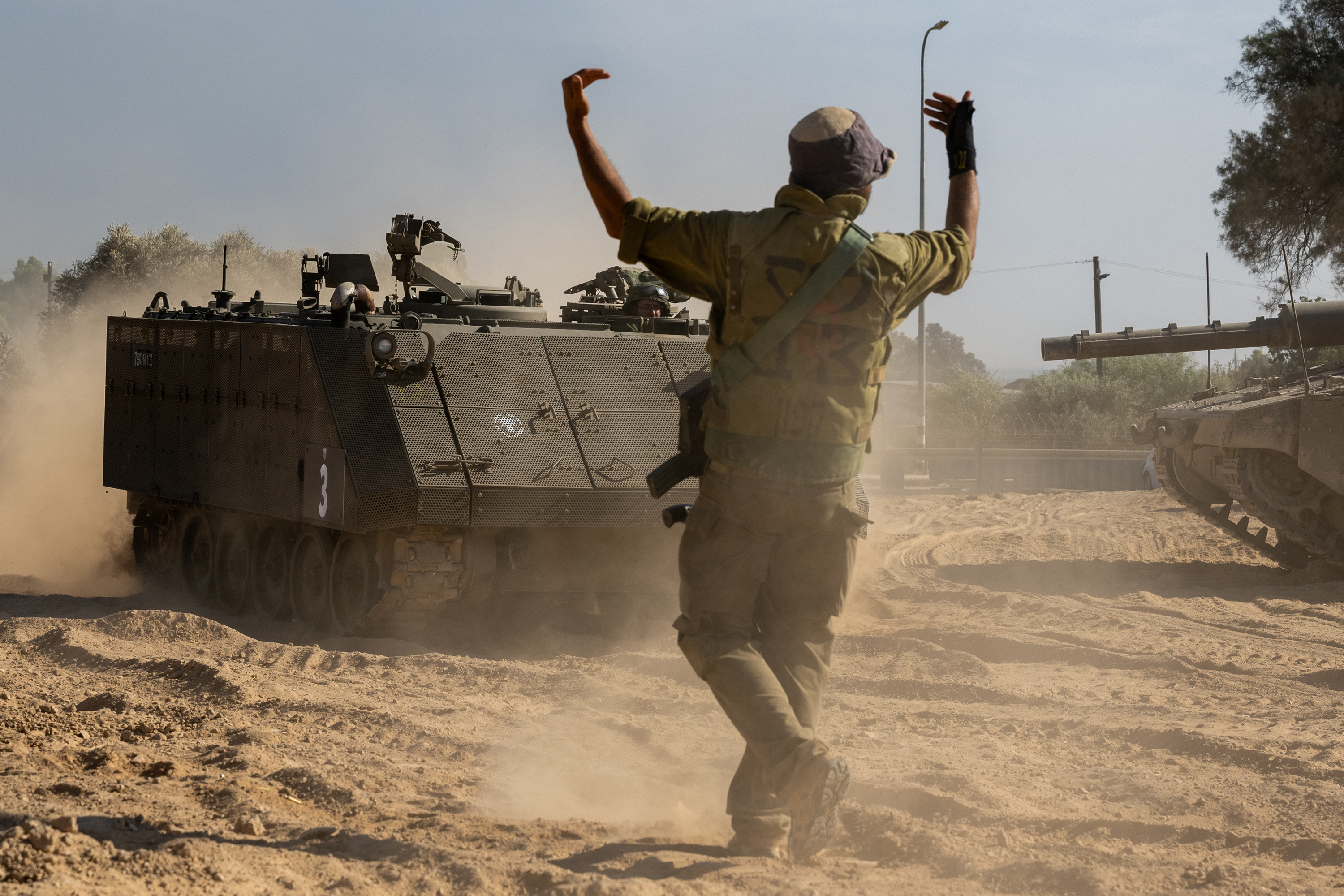 An Israeli soldier guides an armored personnel carrier on October 21, in Southern Israel. 