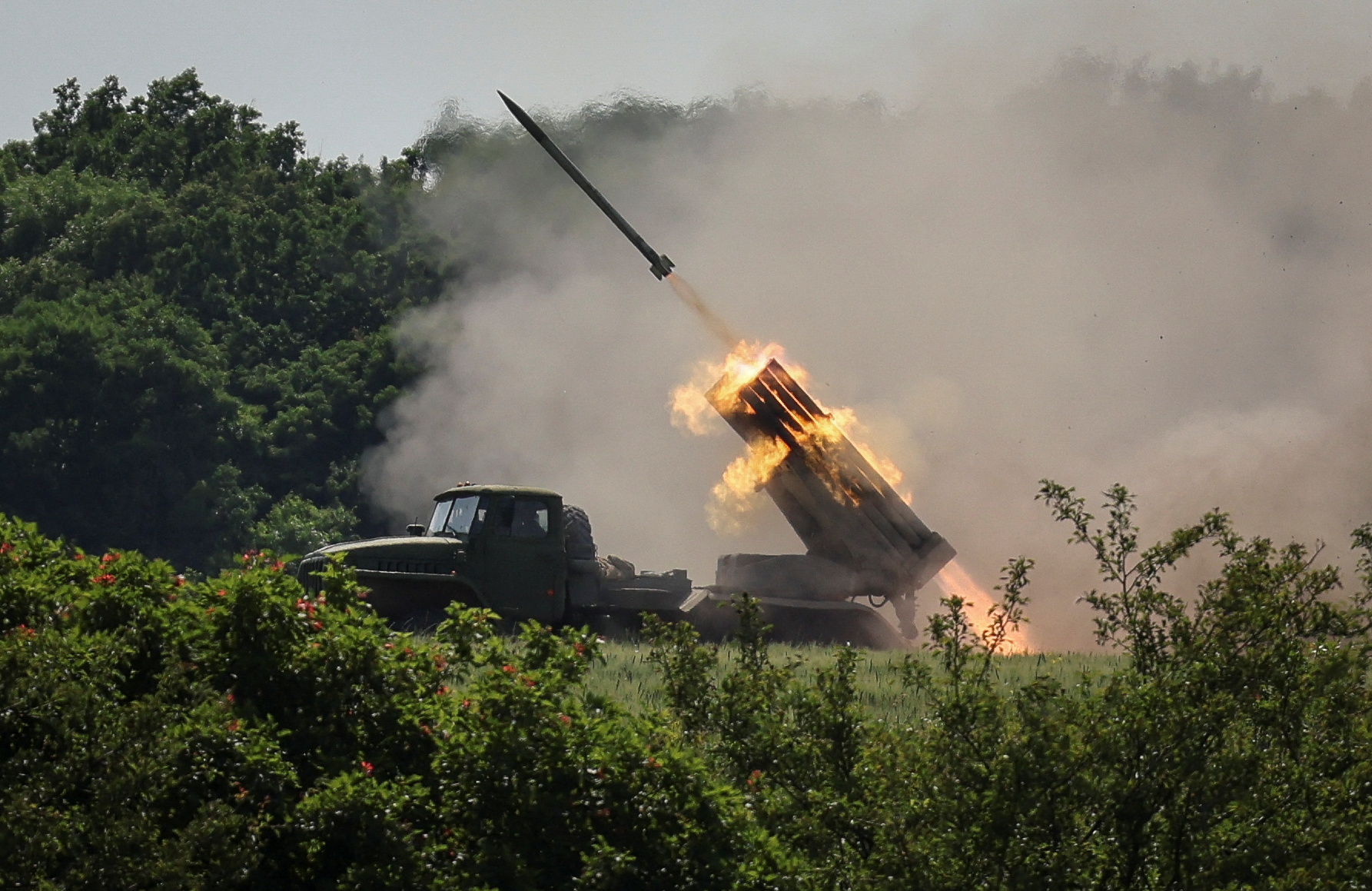Ukrainian service members fire a BM-21 Grad multiple rocket launch system, near the town of Lysychansk, Luhansk region, Ukraine, on June 12.