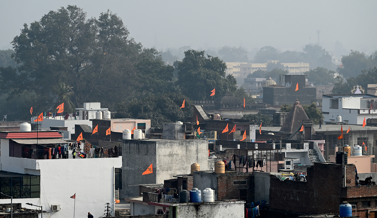 Residents installed saffron flags of the roof of their houses in Ayodhya, India on January 21.