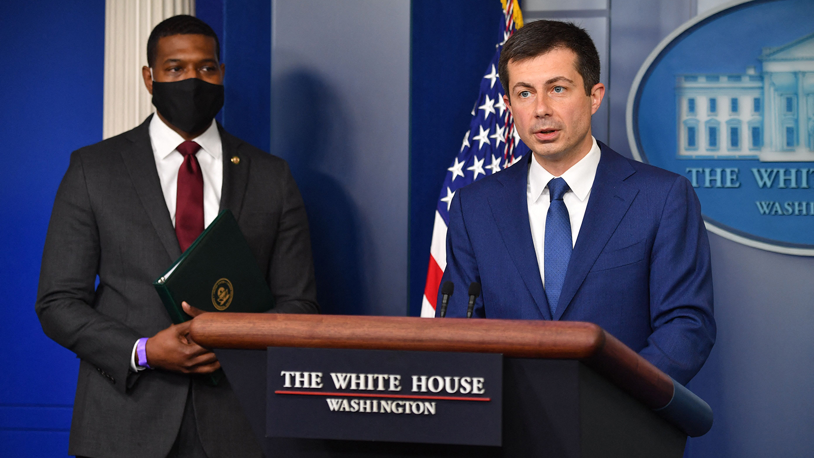 US Transportation Secretary Pete Buttigieg, with Administrator of the Environmental Protection Agency Michael Regan, speaks in the Brady Briefing Room during the daily White House briefing on May 12, in Washington. 