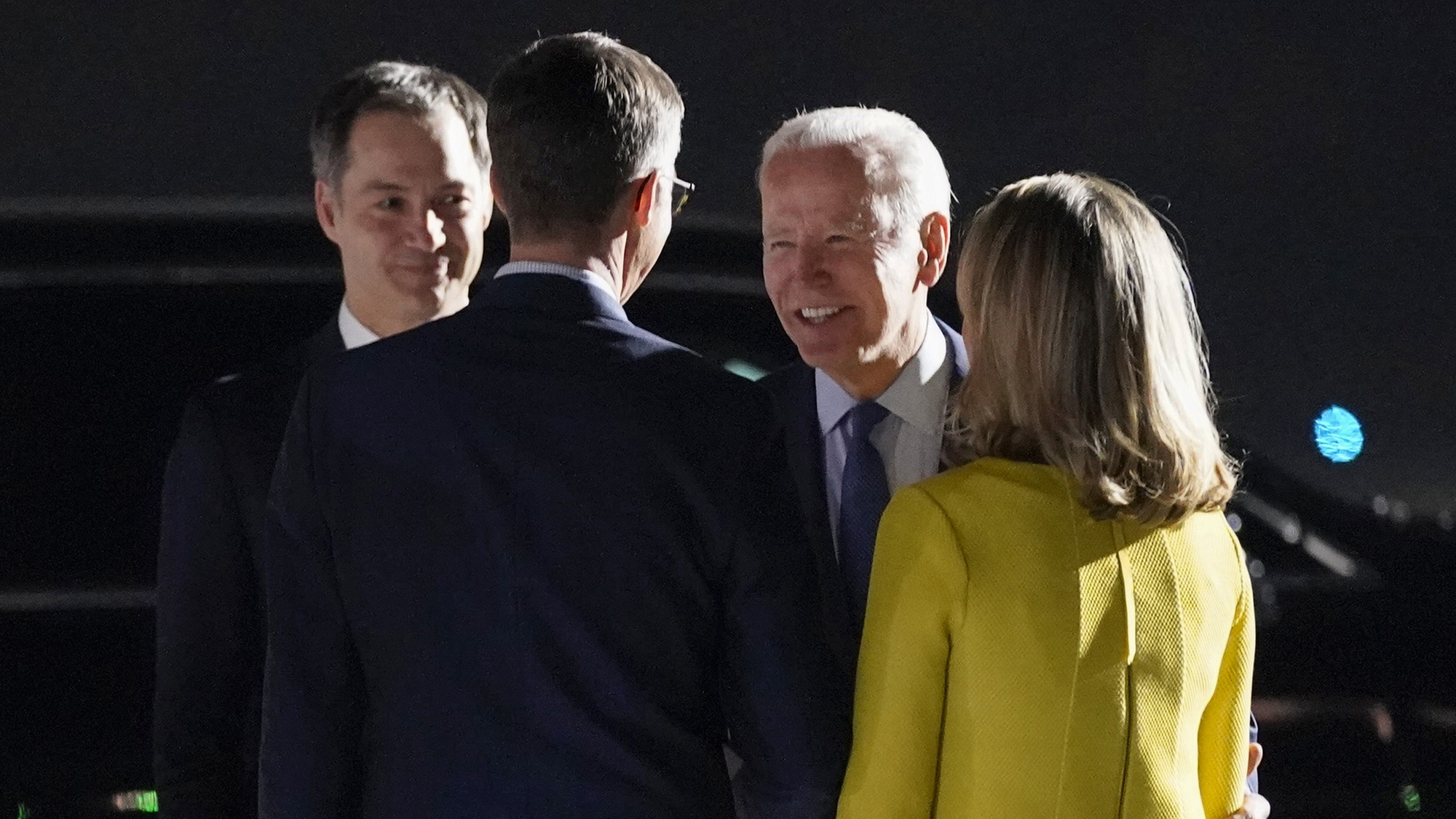 President Joe Biden and Belgian Prime Minister Alexander de Croo, left, speak with others after arriving at Brussels National Airport, Wednesday, March 23.