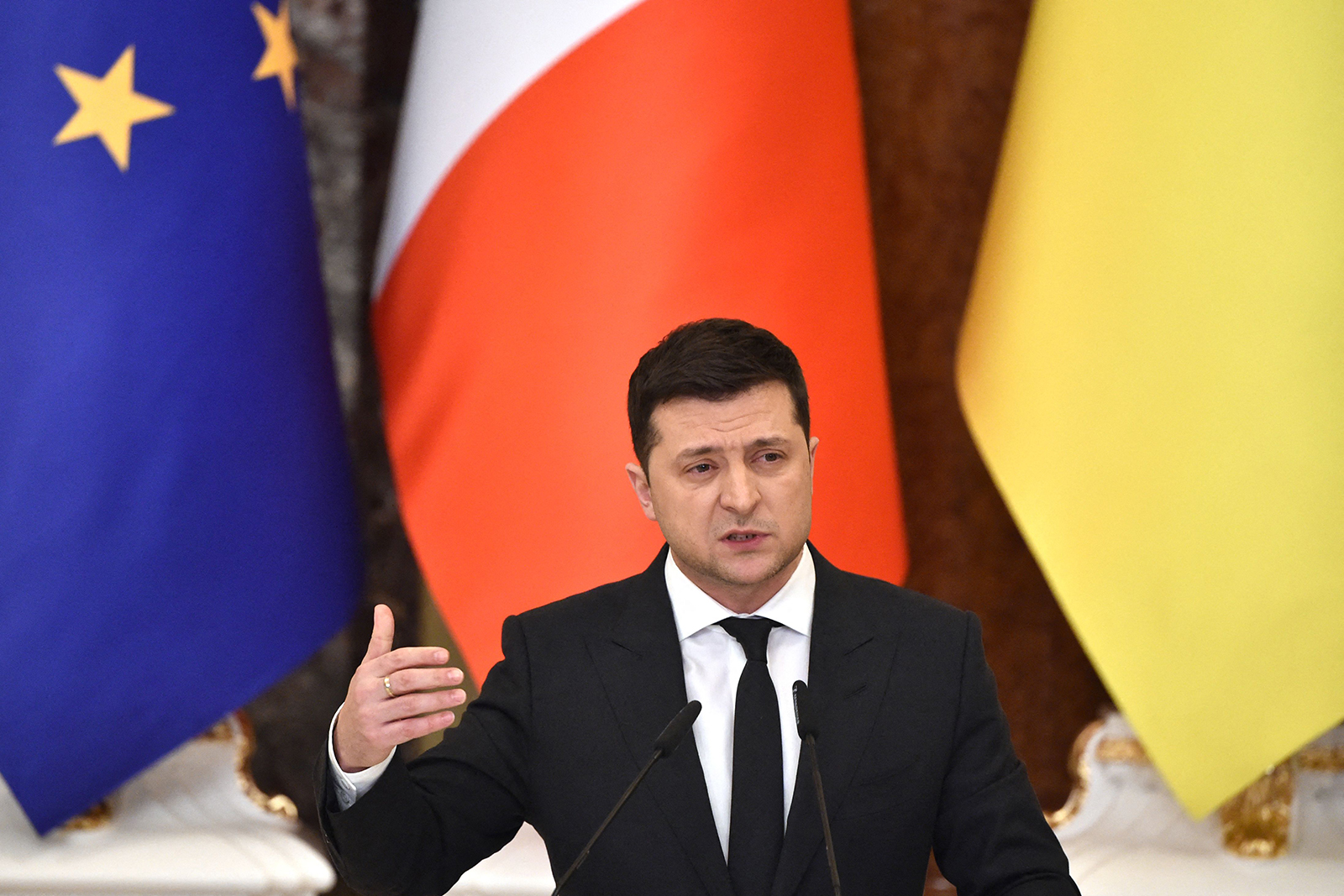 Ukrainian President Volodymyr Zelensky gestures during a joint press conference with French President following their meeting in Kyiv on February 8.