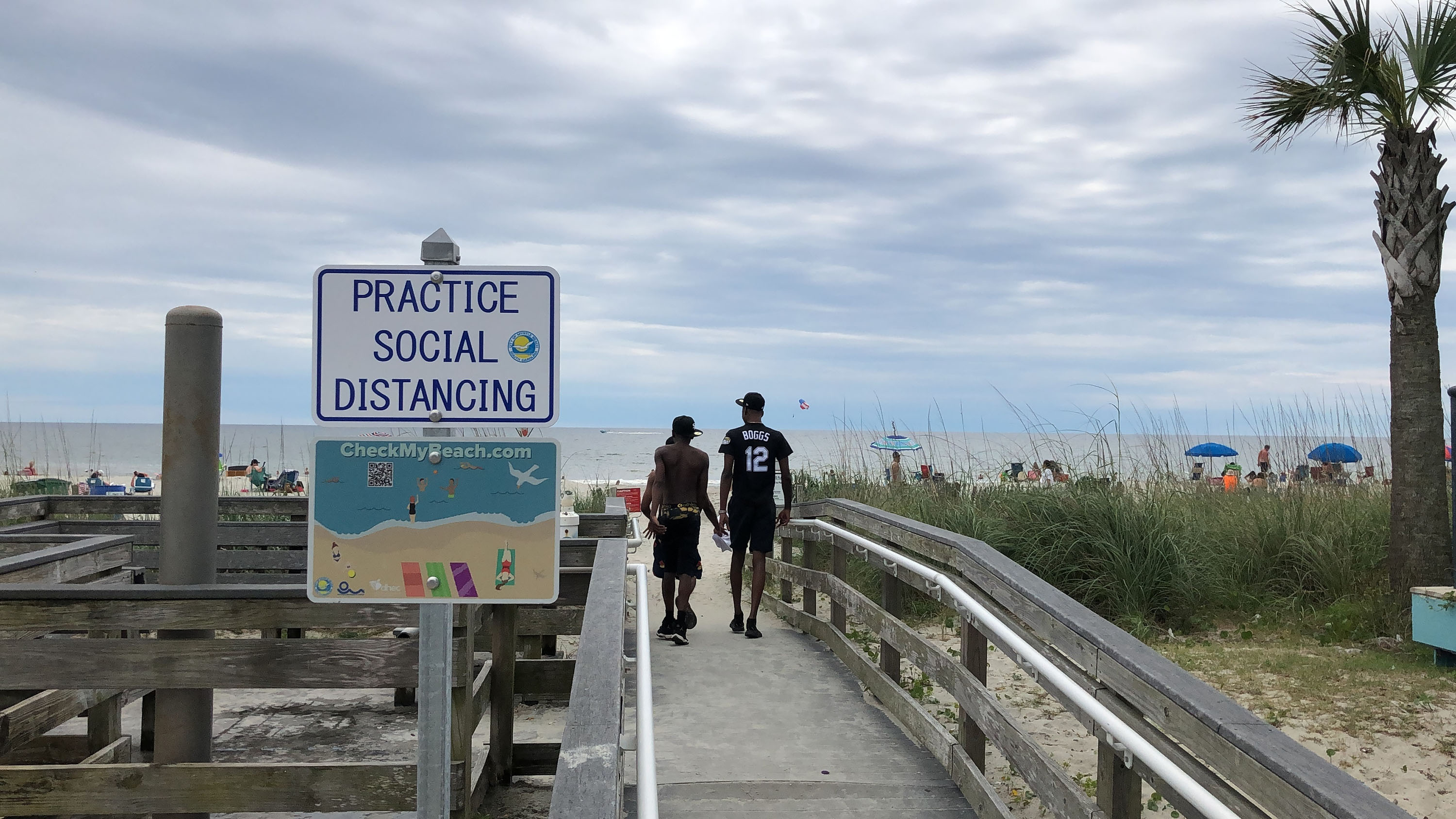 A sign pictured in Myrtle Beach, S.C. on June 18 advises people to maintain social distancing.