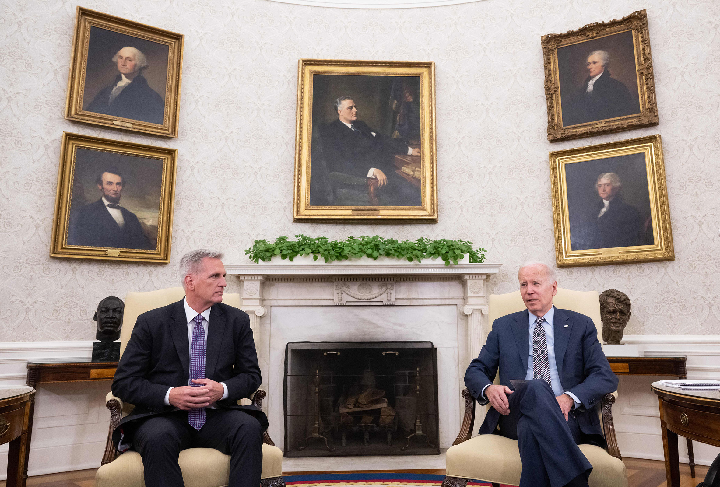 House Speaker Kevin McCarthy and President Joe Biden speaks during a meeting on the debt ceiling in the Oval Office of the White House in Washington, DC, on Monday.