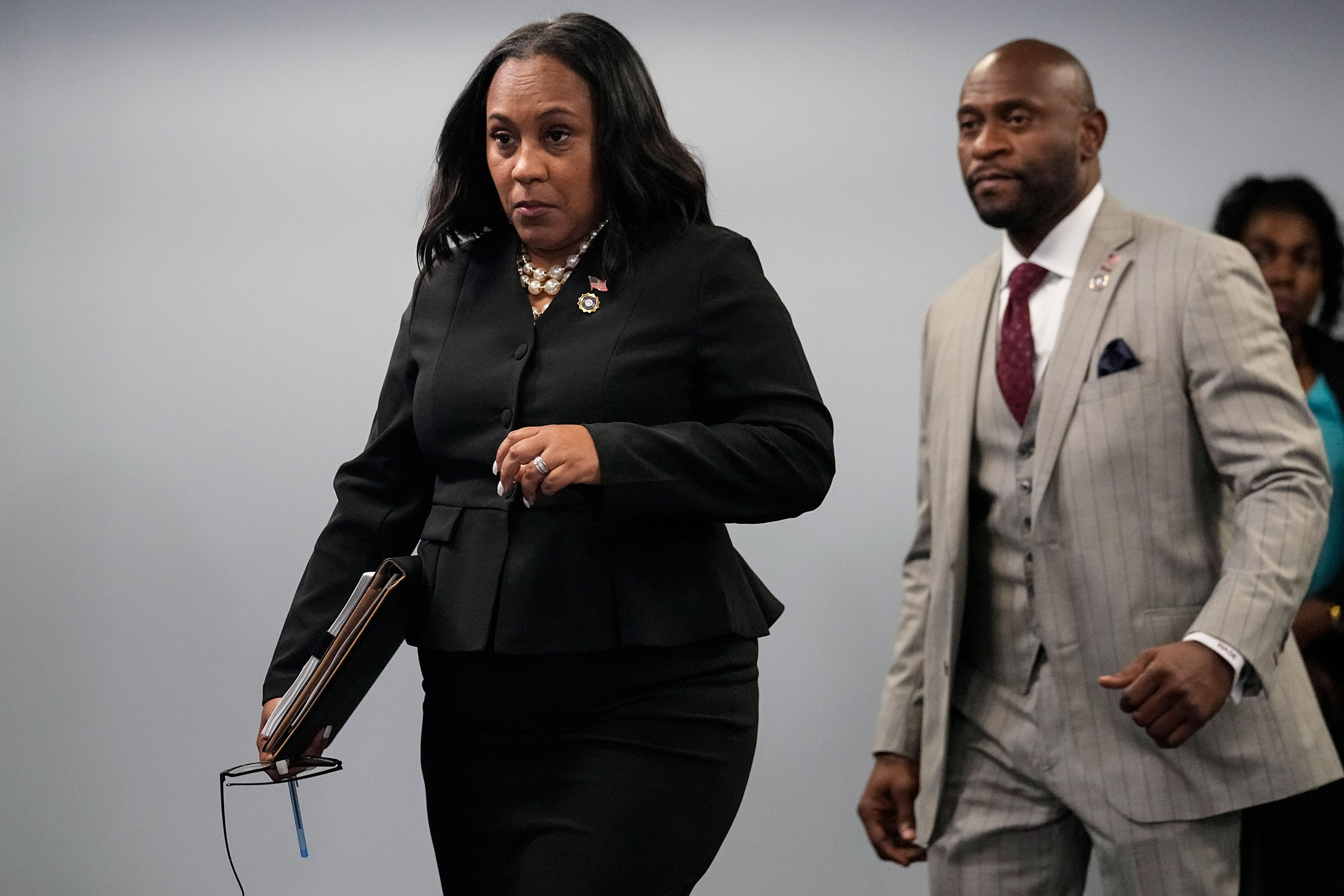 Fulton County District Attorney Fani Willis arrives for a press conference at the Fulton County Government Center in Atlanta on Monday.