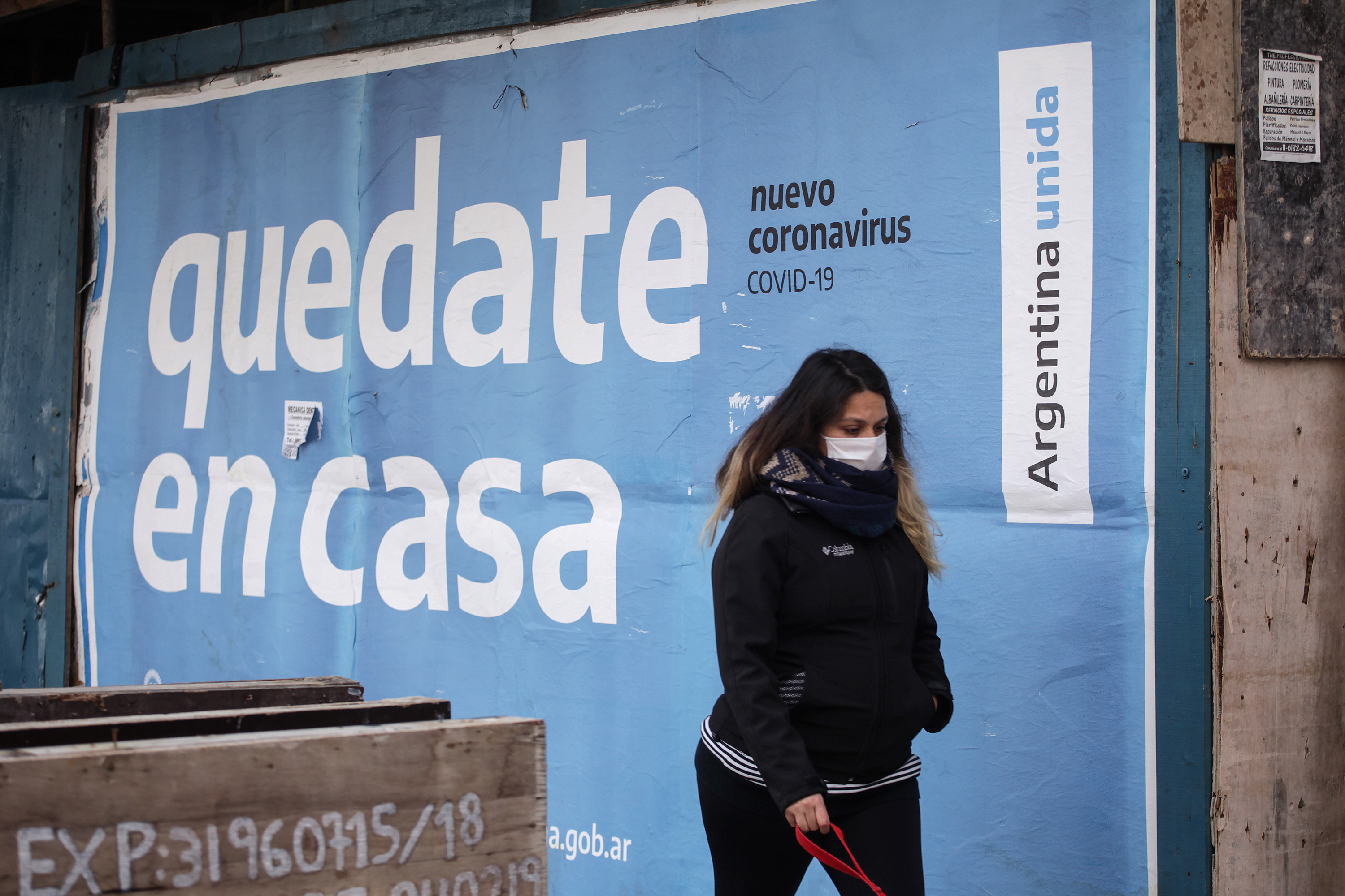 A woman wearing a protective mask walks in Buenos Aires on July 31.