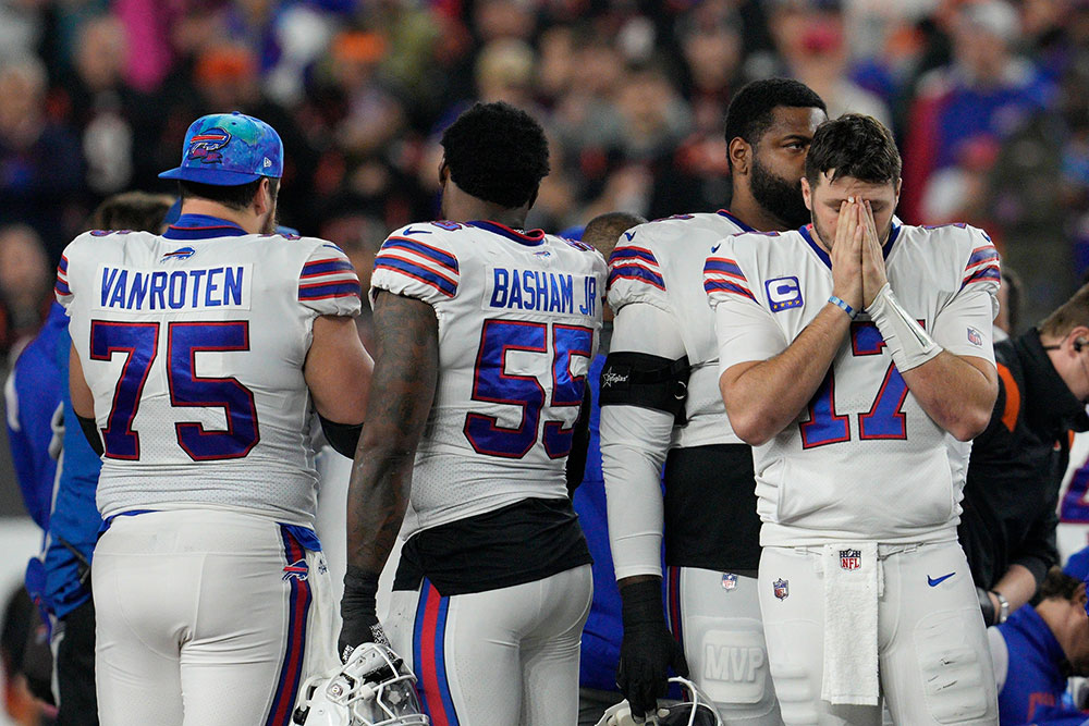 Buffalo Bills quarterback Josh Allen reacts as Hamlin is examined.