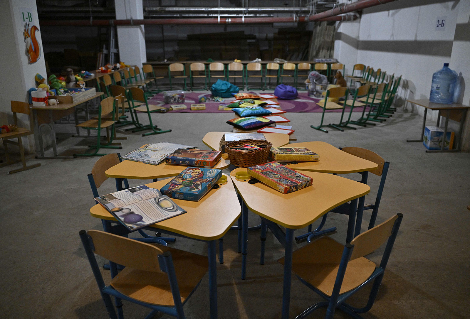 Toys and books are seen inside a bomb shelter in a public school in Kyiv on August 29, 2022. 