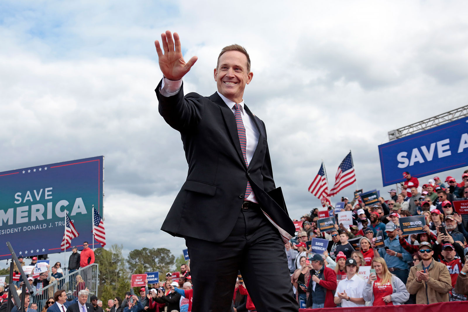 Rep. Ted Budd waves to the crowd after speaking at a rally for former President Donald Trump on April 9 in Selma, North Carolina. 