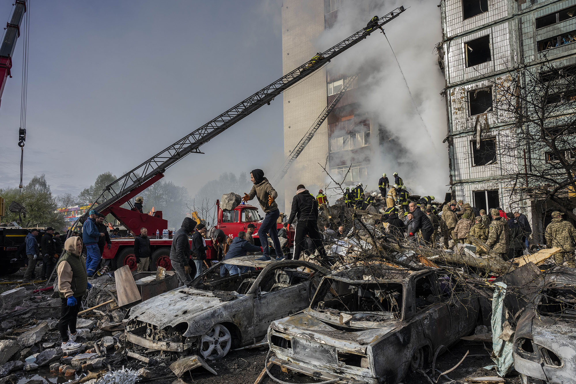 First responders remove rubble at a residential building in Uman, central Ukraine, on April 28.