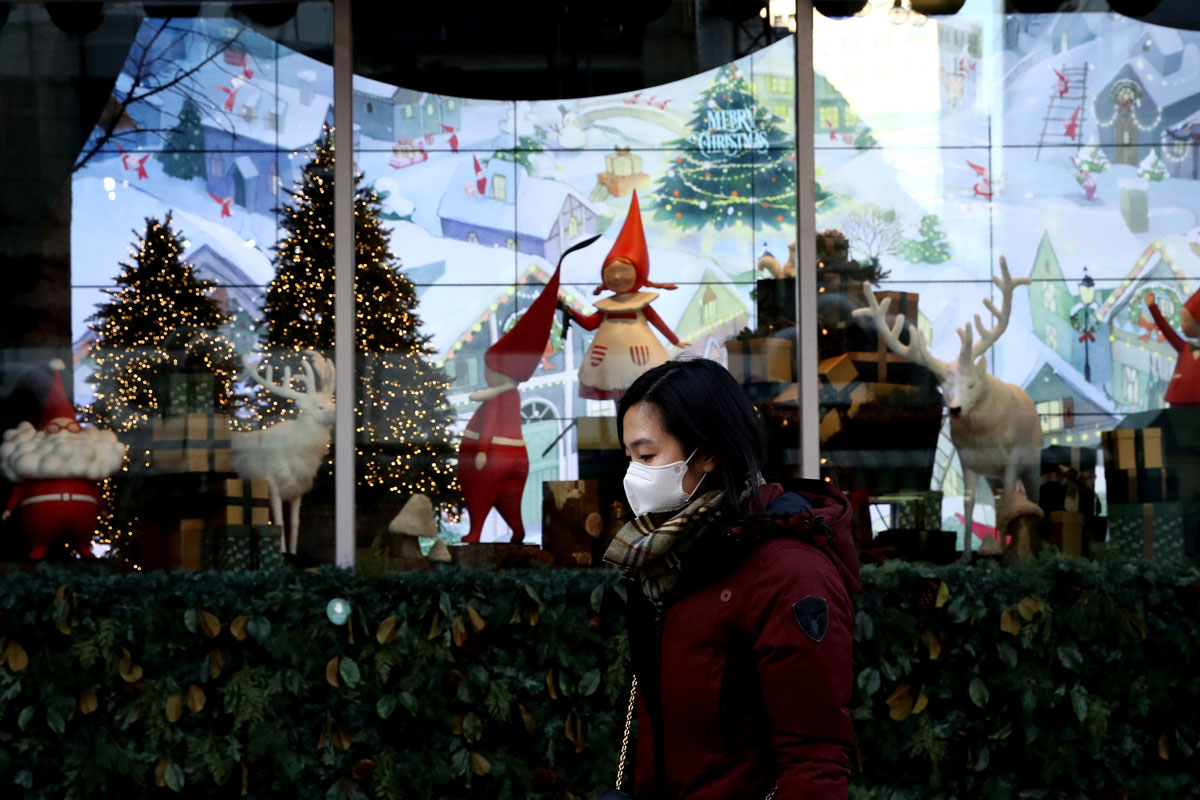 A woman walks along the street on December 18 in Seoul, South Korea. 