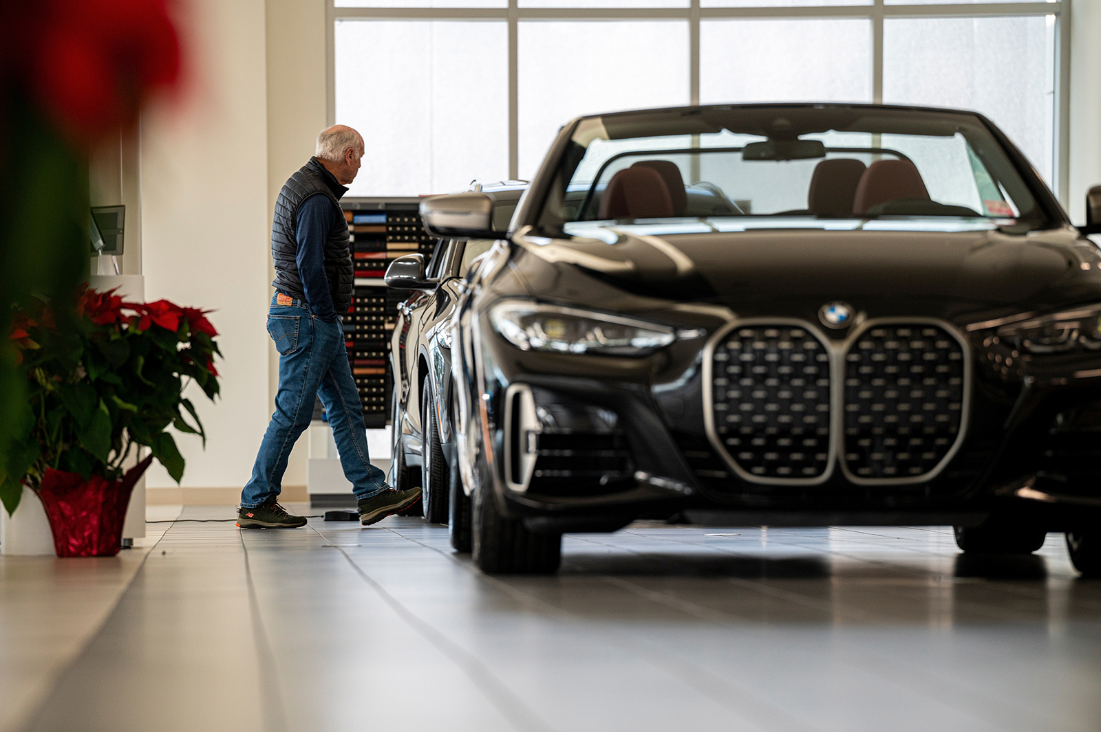 A customer looks at a vehicle at a BMW dealership in Mountain View, California, on December 14.