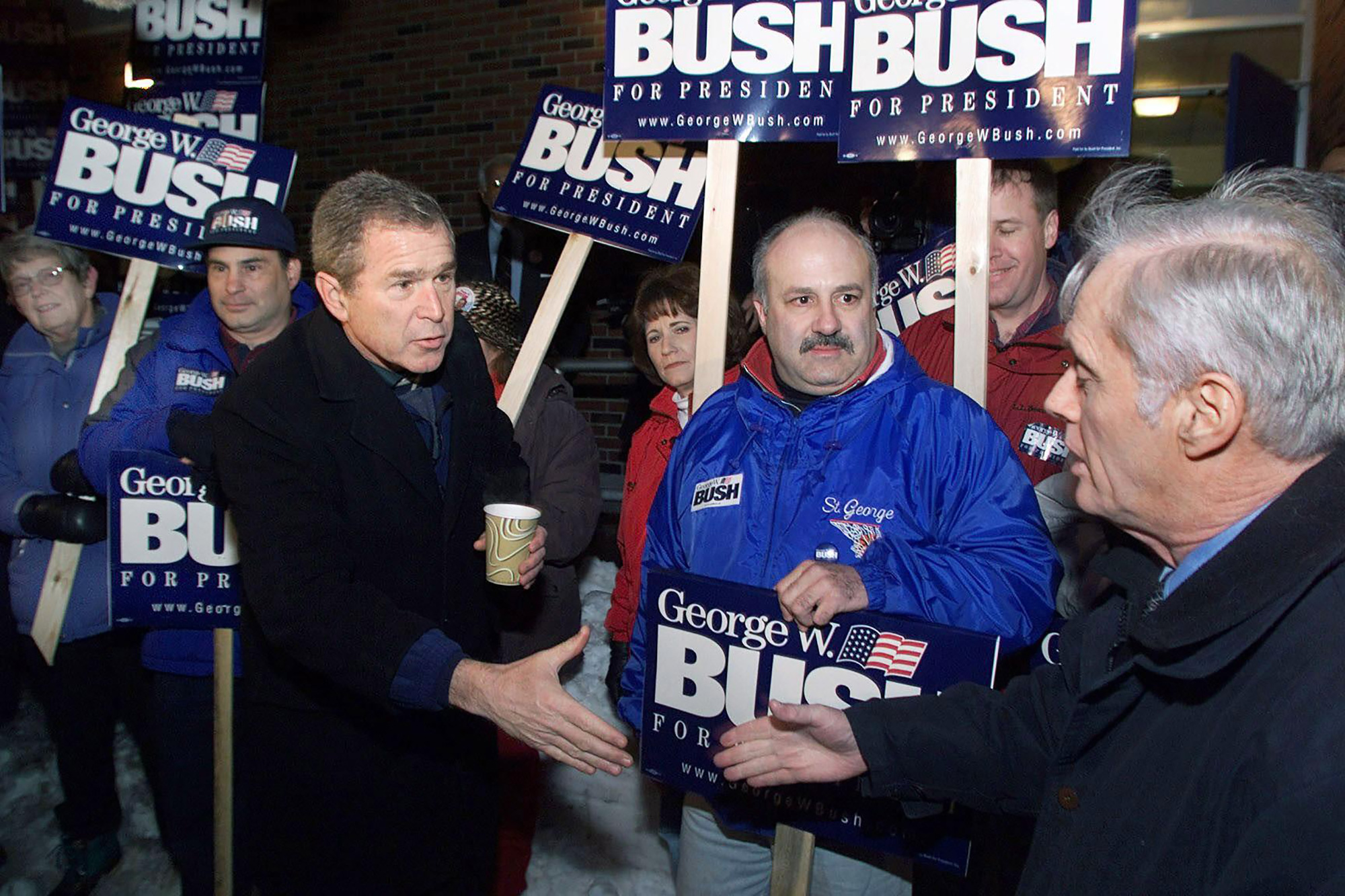 In this 2000 photo, then-Texas Gov. George W. Bush speaks to voters in Manchester, New Hampshire.