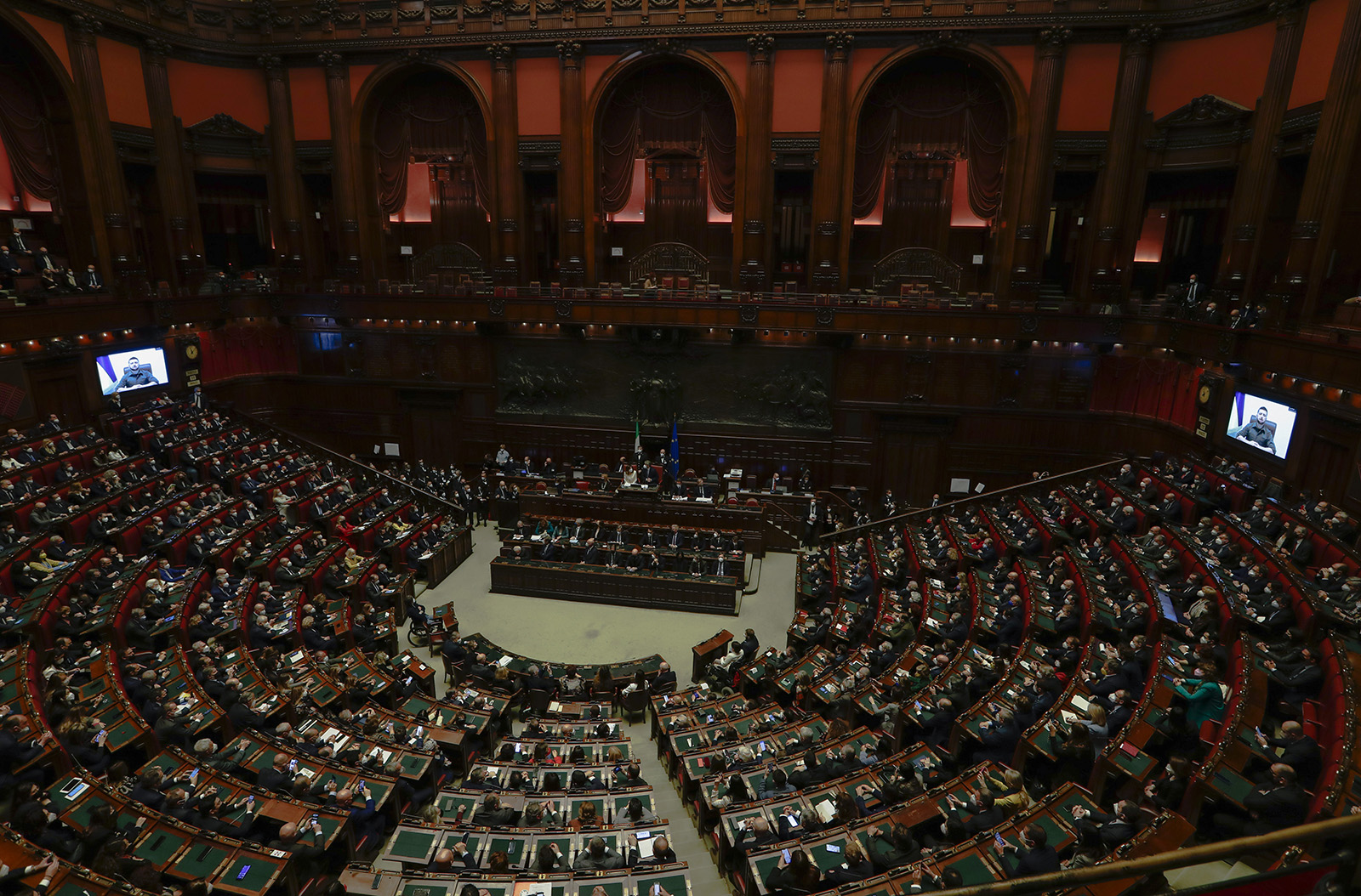 Members of the Italian Parliament and government listen to Ukraine President Volodymyr Zelensky during his virtual address to the parliament in Rome, Italy, on March 22.