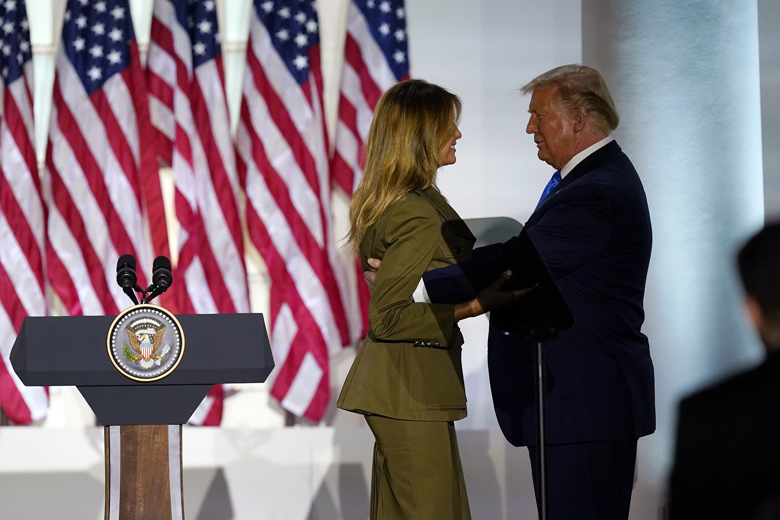 President Donald Trump joins first lady Melania Trump on stage after her speech to the 2020 Republican National Convention from the Rose Garden of the White House, on Tuesday in Washington.