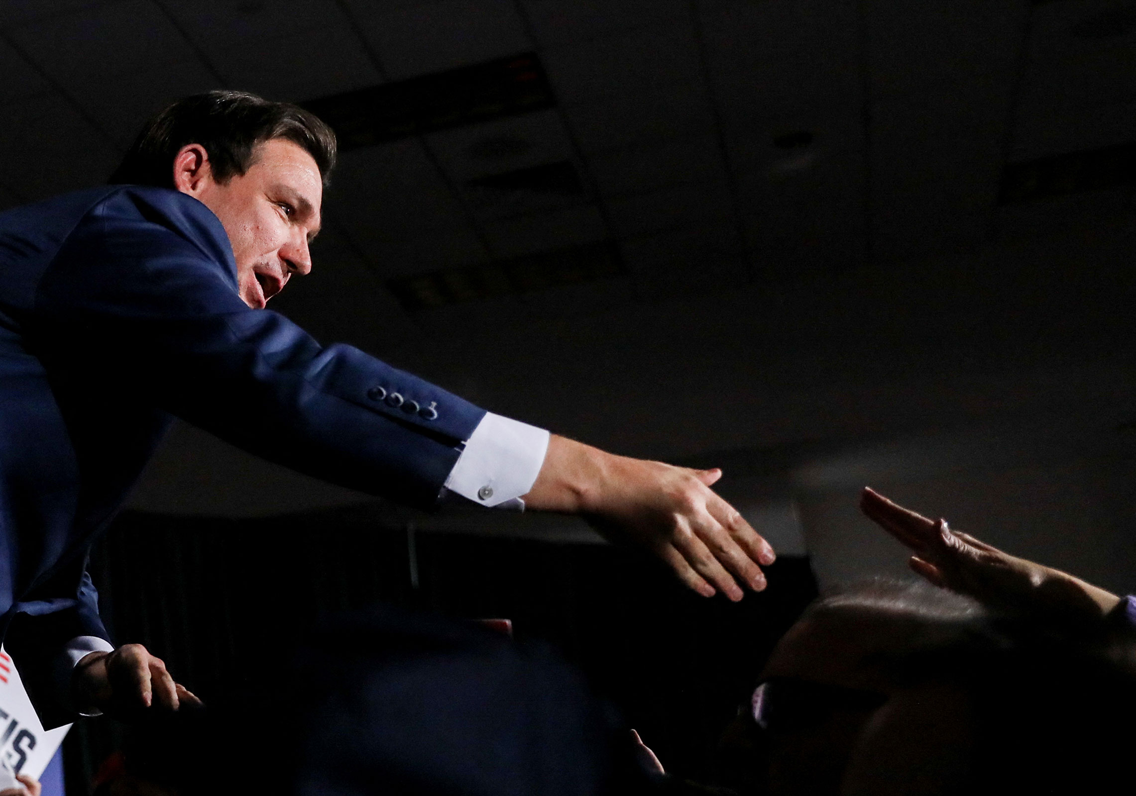 Ron DeSantis greets supporters at his Iowa caucus watch party in West Des Moines, Iowa, yesterday.