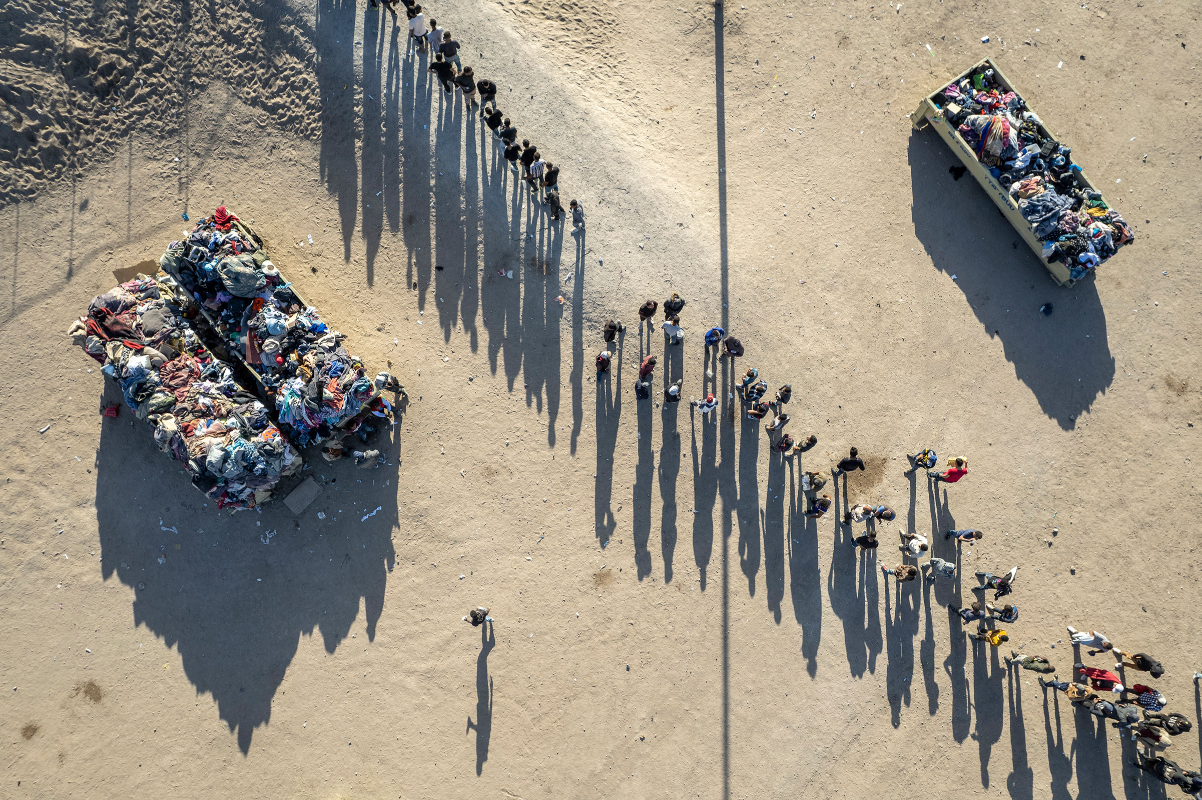As seen from an aerial view, immigrants line up to be processed by U.S. Border Patrol agents at the U.S.-Mexico border on May 12 in El Paso, Texas. 