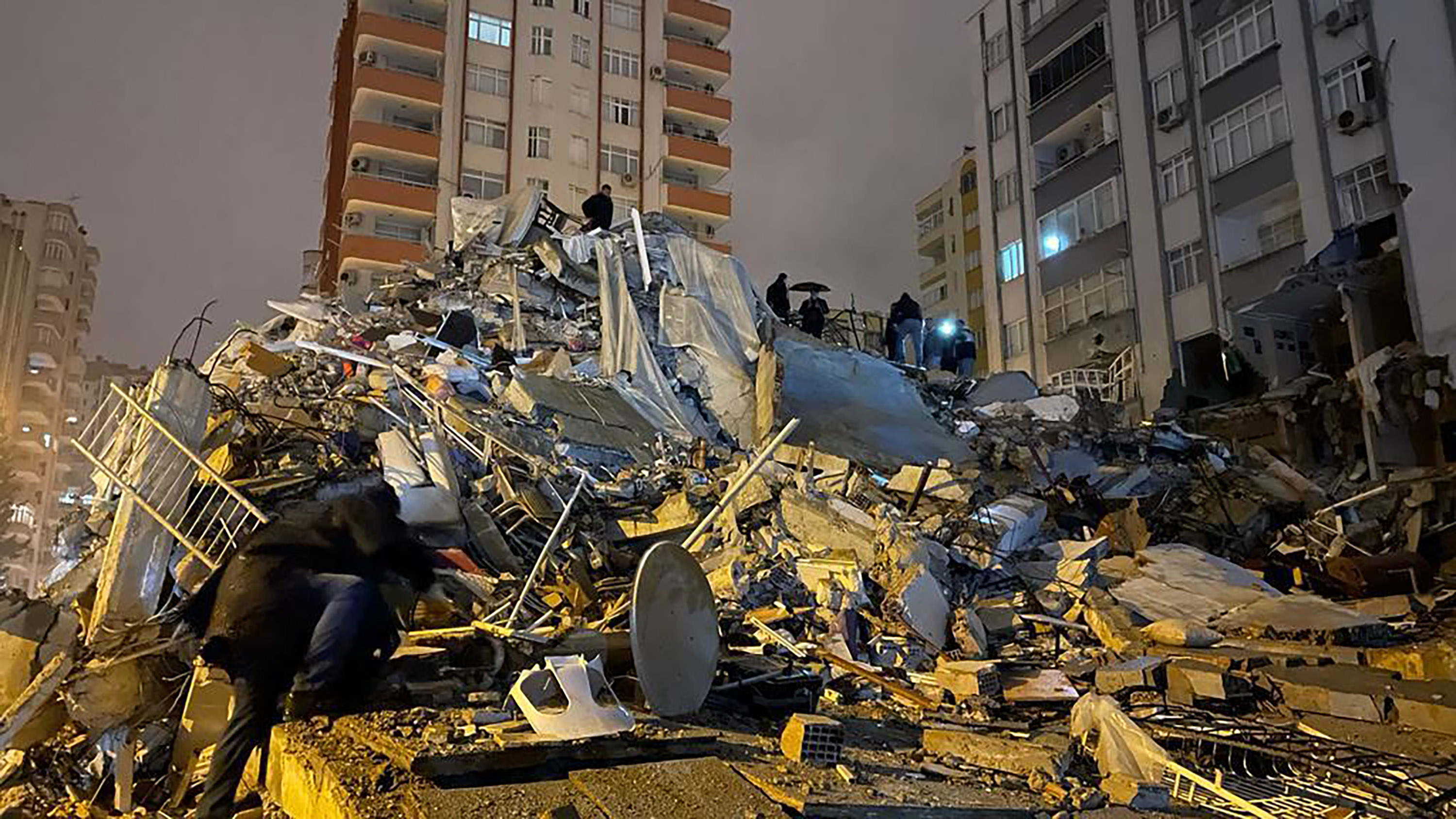 A view of the destroyed building after earthquakes jolts Turkey's provinces, on February 6, in Adana, Turkey.