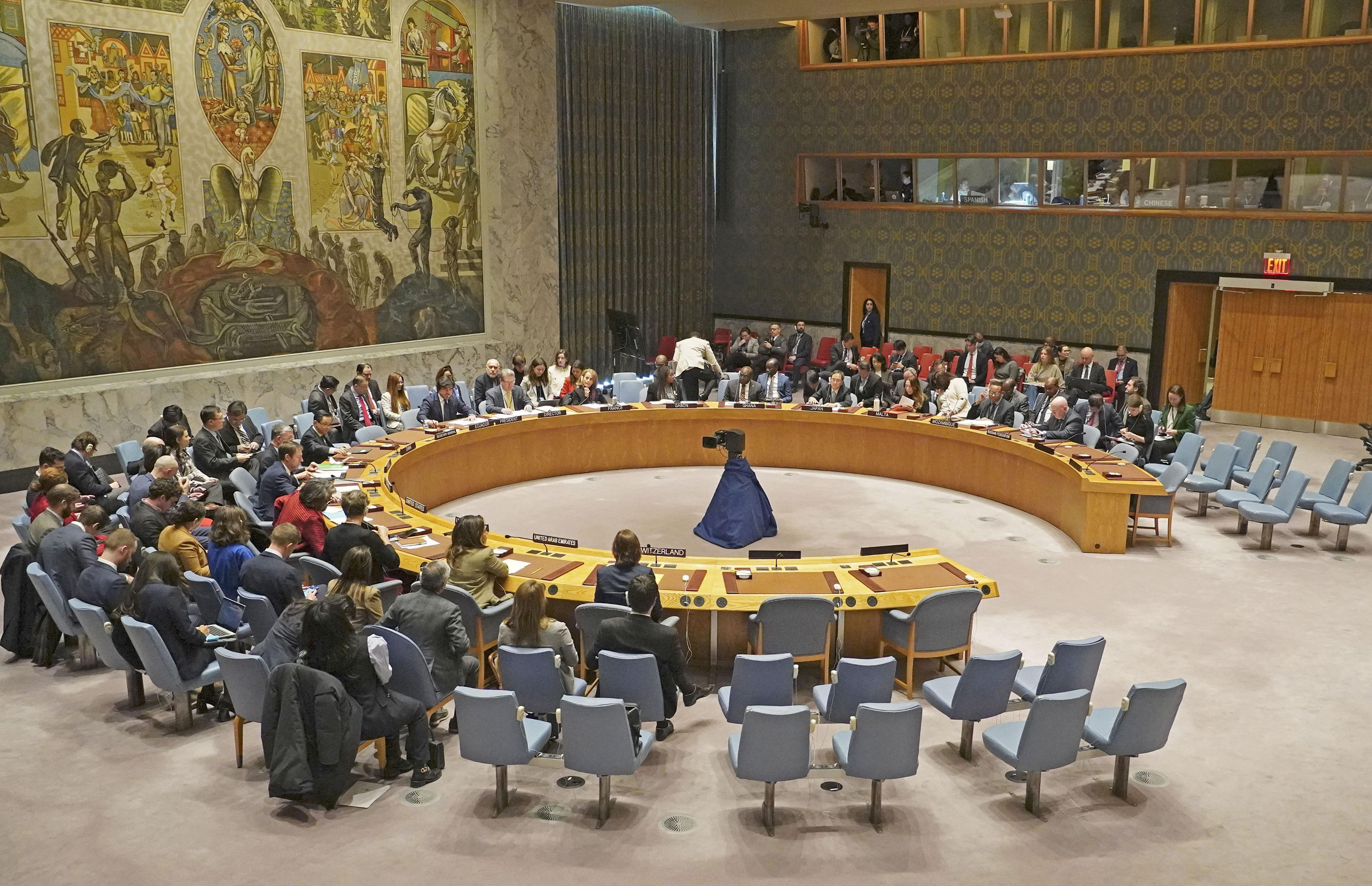 The UN Security Council adopts a resolution calling for speeding up aid deliveries to civilians in Gaza, at the UN headquarters in New York on December 22.